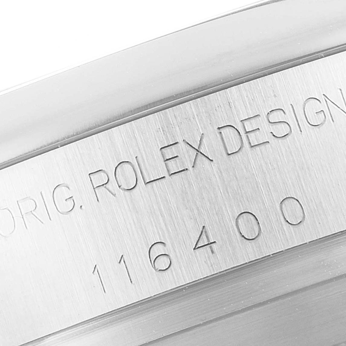 The image shows a close-up of the case side of a Rolex Milgauss 116400 Men's Stainless Steel Black Dial 116400 Men's Stainless Steel Black Dial model, displaying the engraved design and reference number "116400."