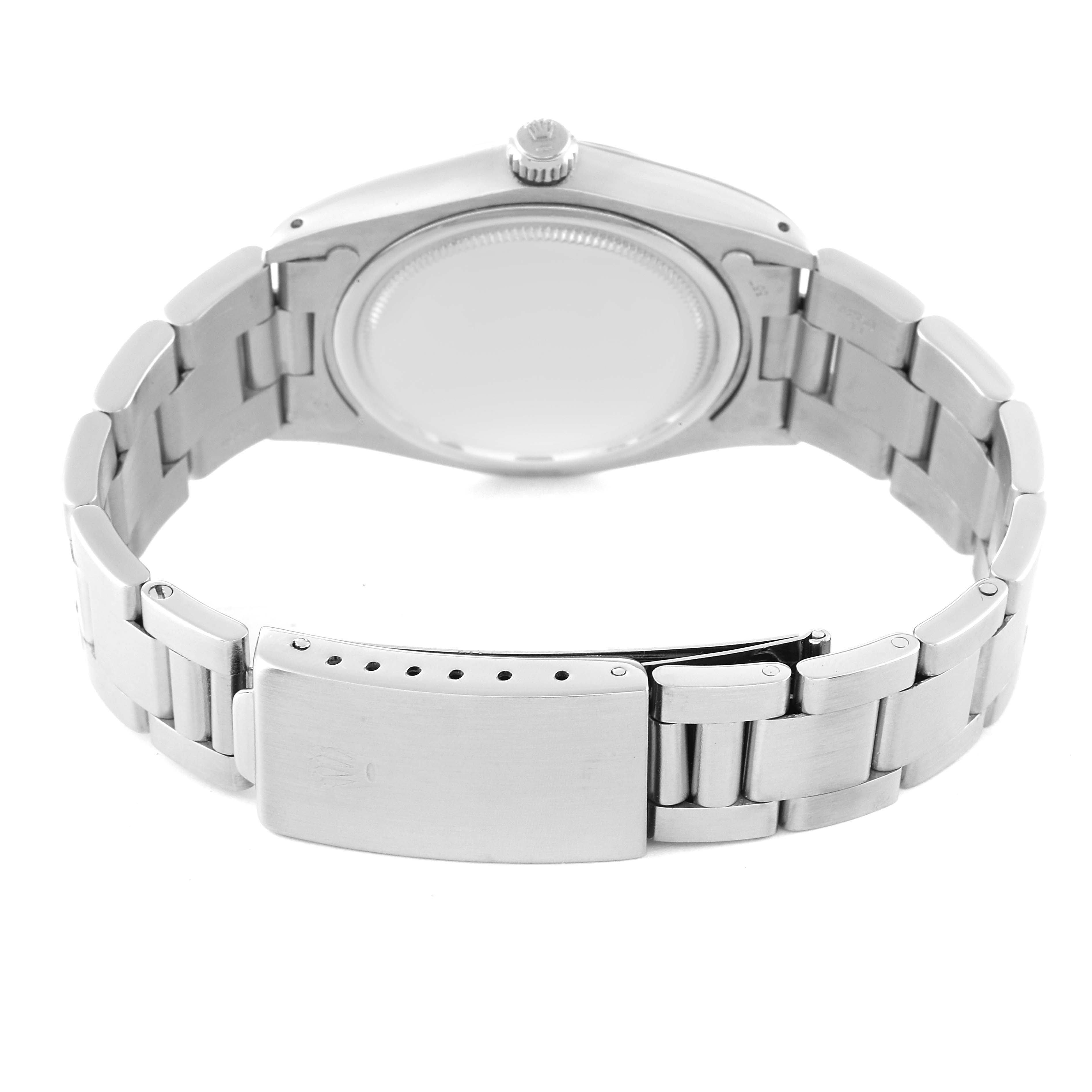 The image shows the back view of a Rolex Date 6694 Men's Stainless Steel Silver Dial 6694 Men's Stainless Steel Silver Dial model watch with the bracelet and clasp visible.