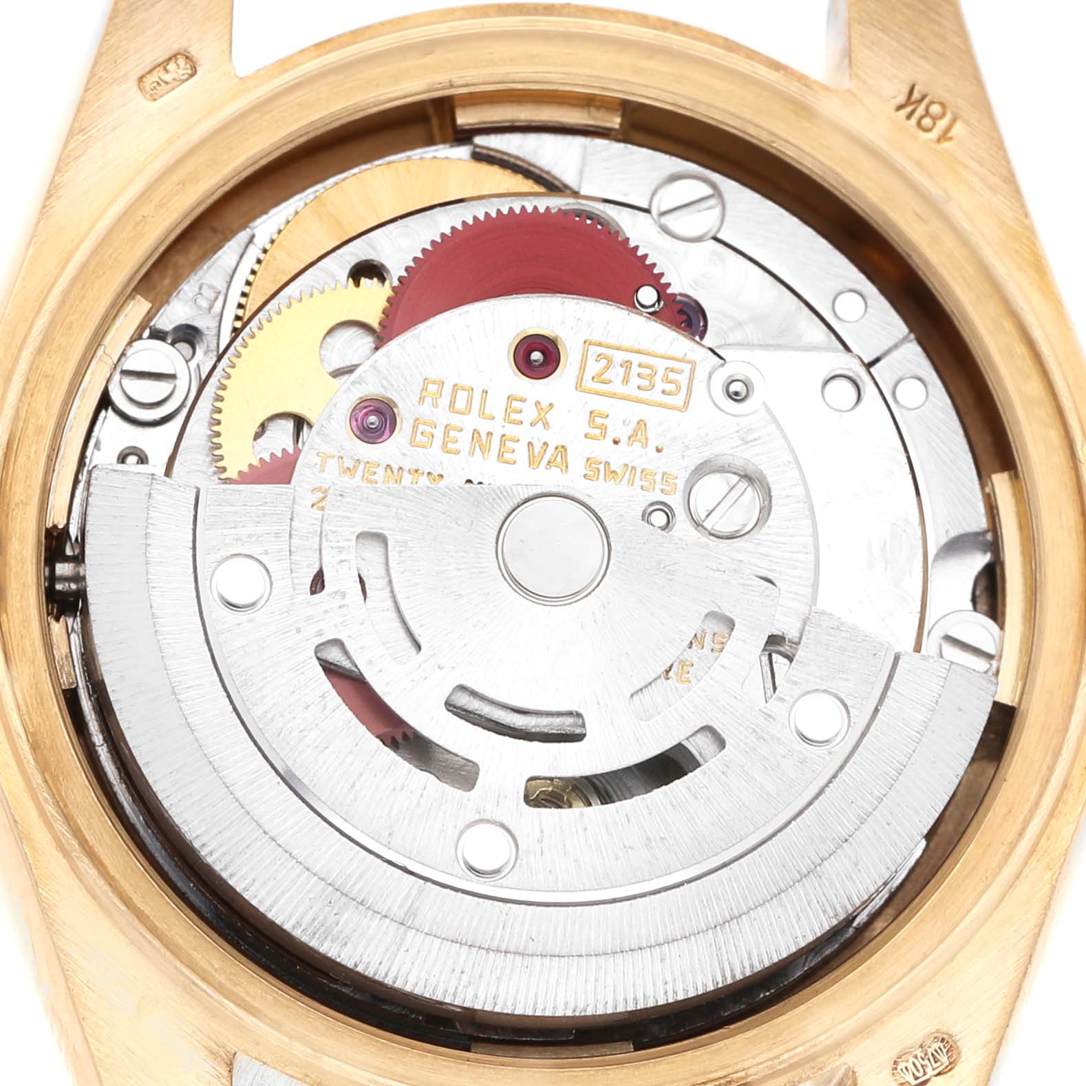 The image shows the movement mechanism of a Rolex Datejust 69178 Women's Yellow Gold Champagne Dial watch from a back angle, highlighting gears and inscriptions.