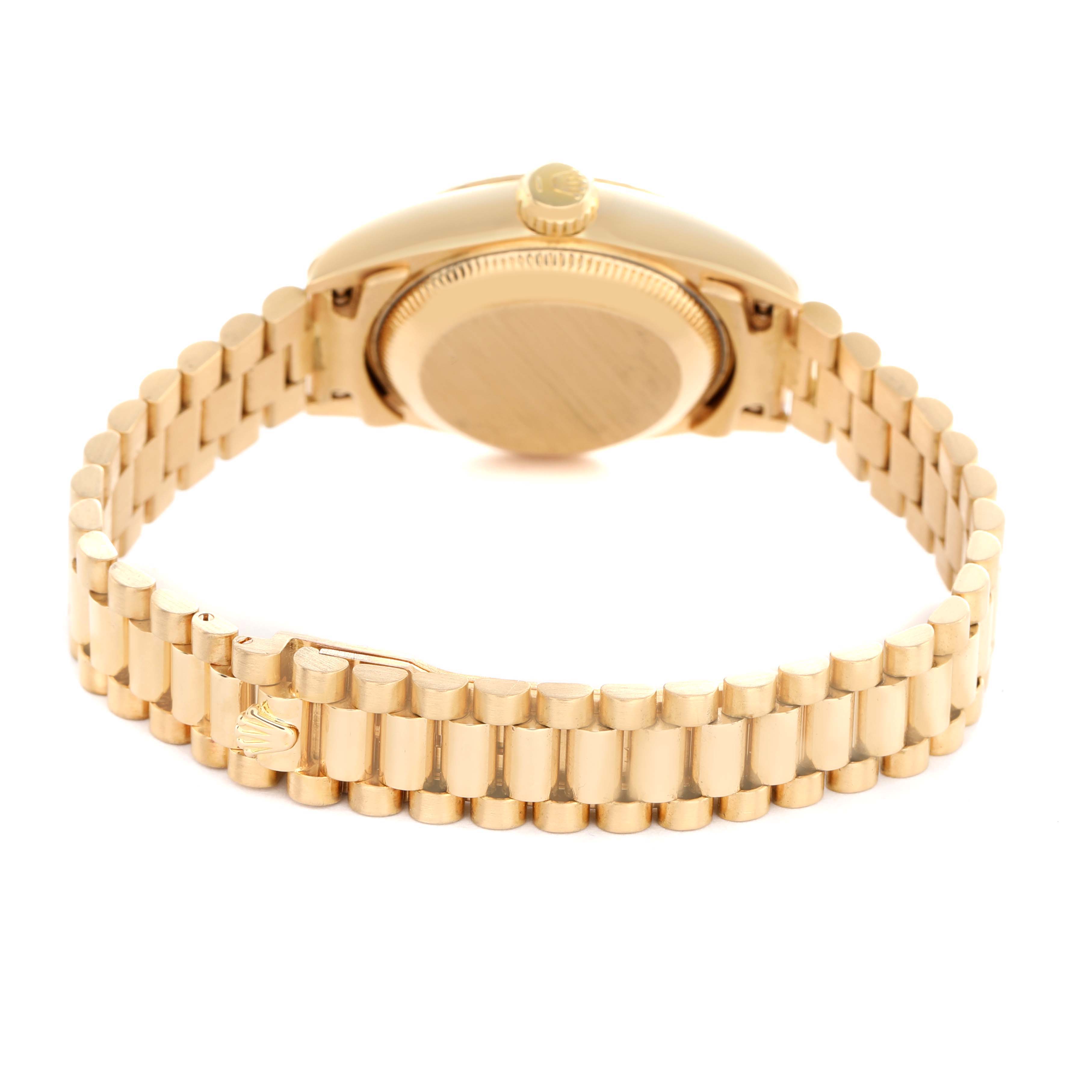 The image shows a Rolex Datejust 69178 Women's Yellow Gold Champagne Dial watch from the back, highlighting the bracelet, clasp, case back, and crown.