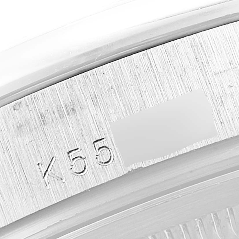 This image shows a close-up of the engraved case back of a Rolex President 118206 Men's Platinum Silver Dial 118206 Men's Platinum Silver Dial model watch.