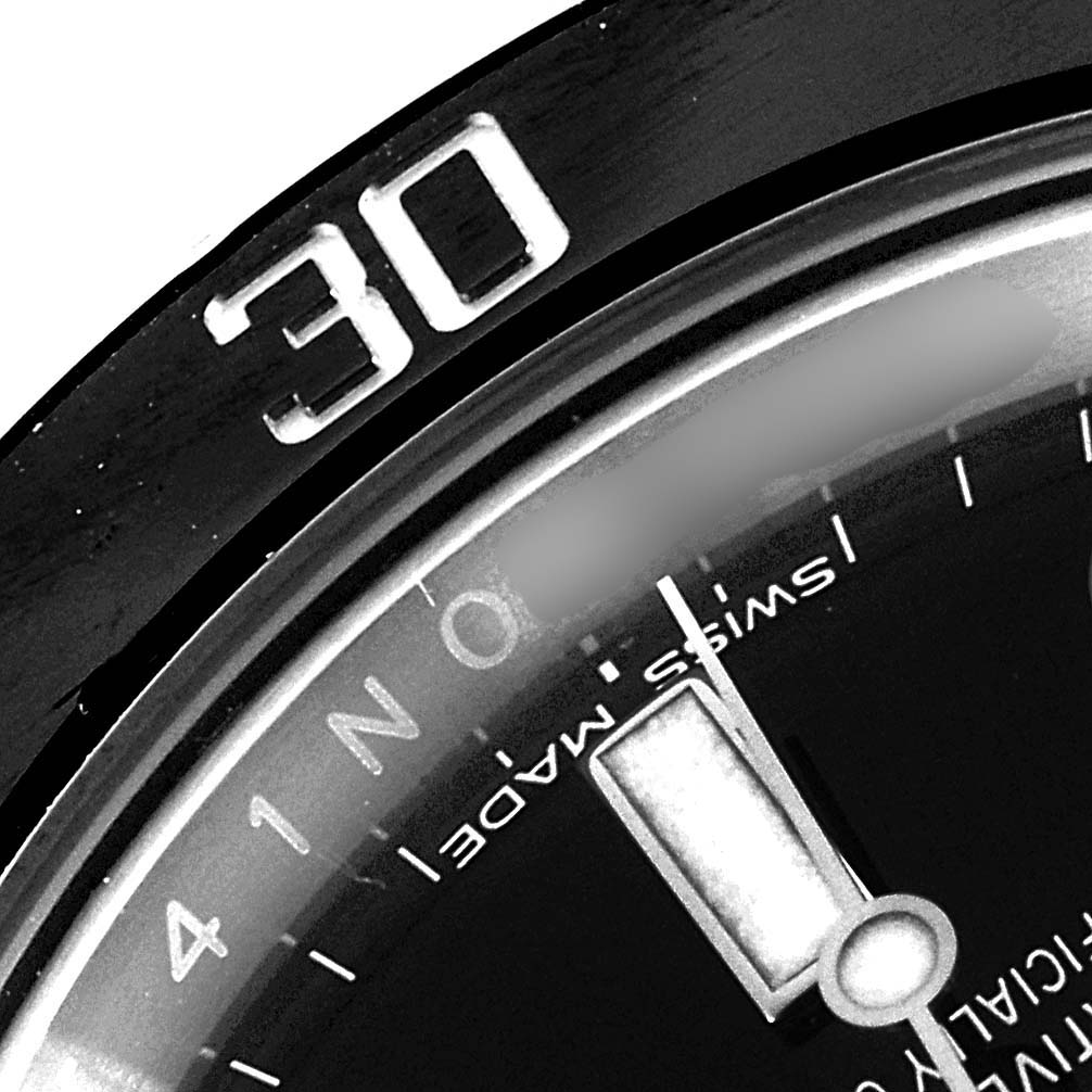 The image shows a close-up angle of the bezel and part of the dial of a Rolex Submariner 114060 Men
s Stainless Steel Black Dial 114060 Men
s Stainless Steel Black Dial, focusing on the "30" marker.