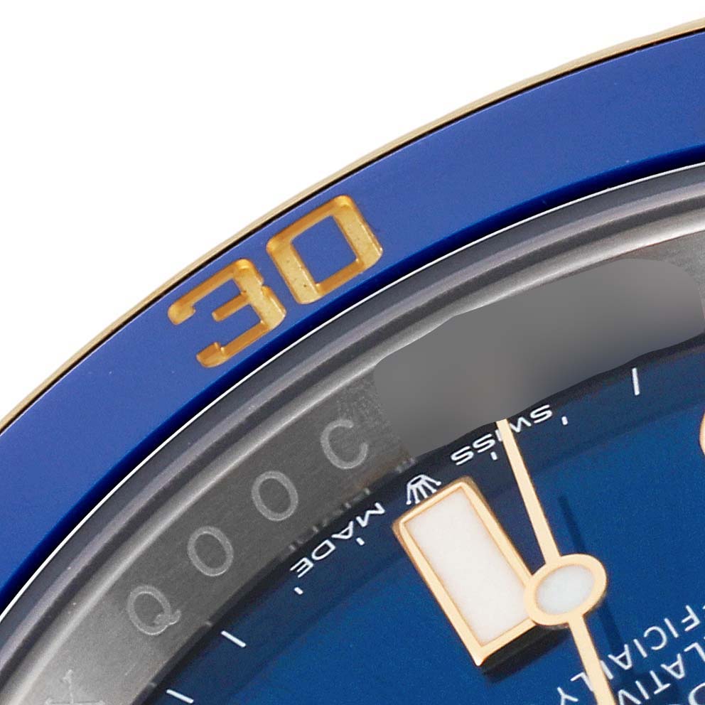 The image shows a close-up of the bezel and part of the dial of the Rolex Submariner 126613LB Men's Steel and Gold (two tone) Blue Dial 126613LB Men's Steel and Gold (two tone) Blue Dial, highlighting the "30" mark.