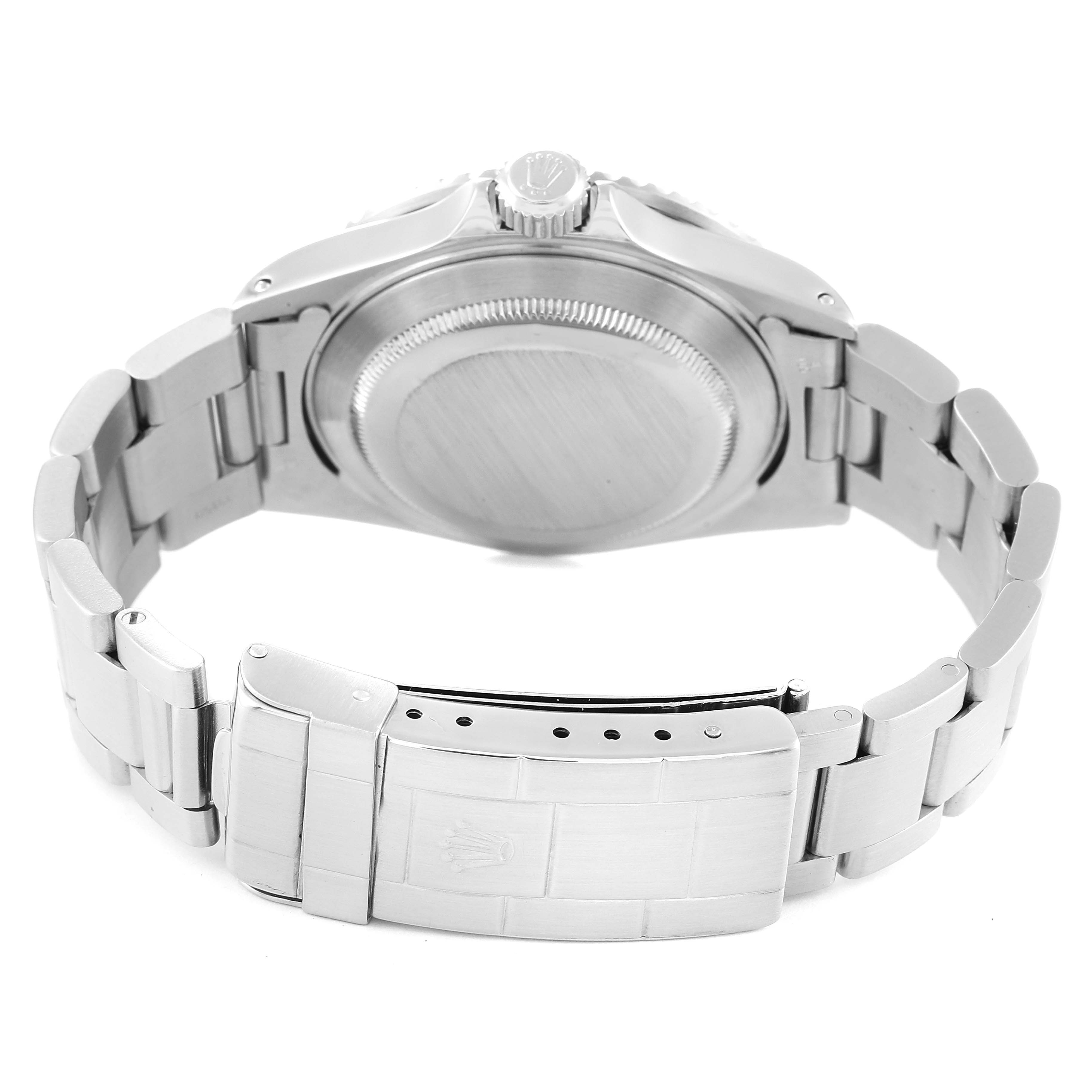 The image shows the back view of a Rolex Submariner 16610 Men
s Stainless Steel Black Dial 16610 Men
s Stainless Steel Black Dial watch, focusing on the case back, bracelet, and clasp.