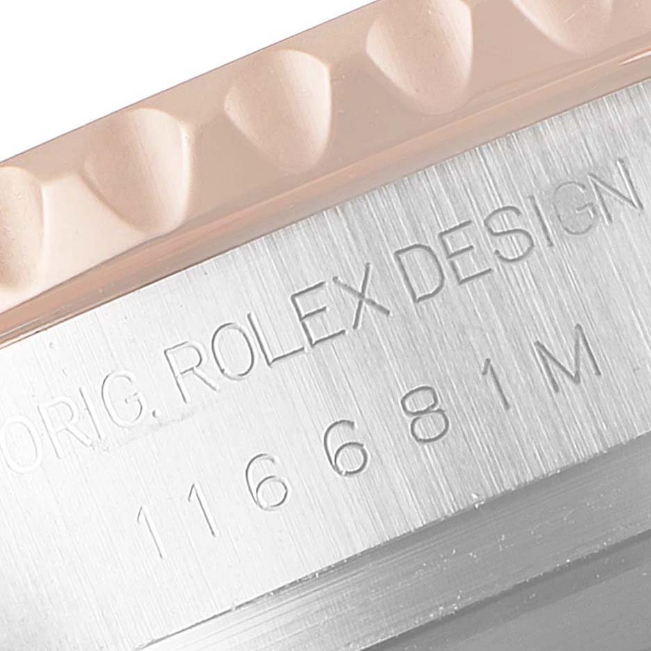 This image shows a close-up of the bezel and engraved stainless steel side of a Rolex Yacht-Master 116681 Men
s Steel and Gold (two tone) White Dial 116681 Men
s Steel and Gold (two tone) White Dial watch.