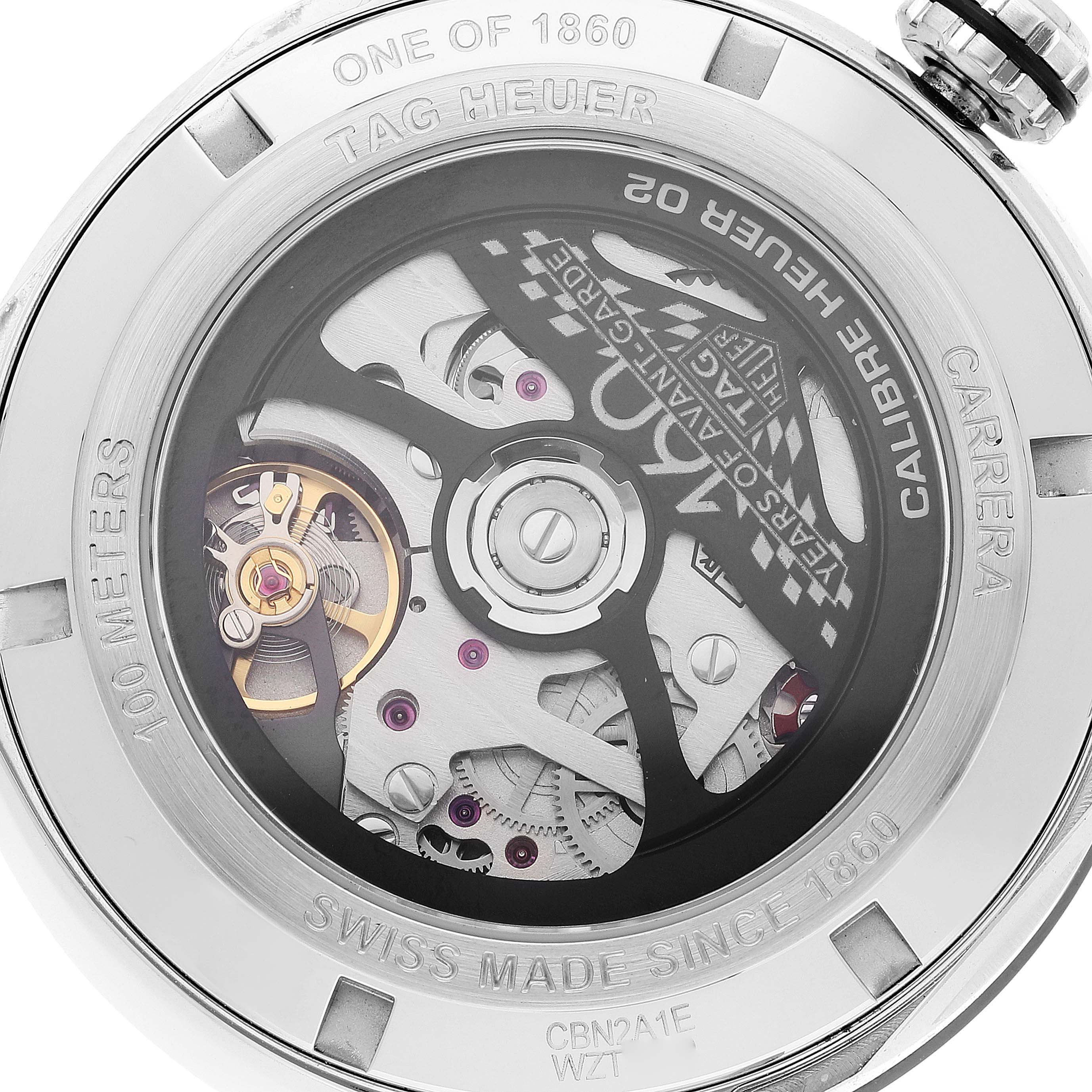 The image shows the back view of the Tag Heuer Carrera CBN2A1E.BA0643 Men's Stainless Steel Blue Dial CBN2A1E.BA0643 Men's Stainless Steel Blue Dial watch, revealing the intricate movement and Calibre Heuer 02 mechanism.