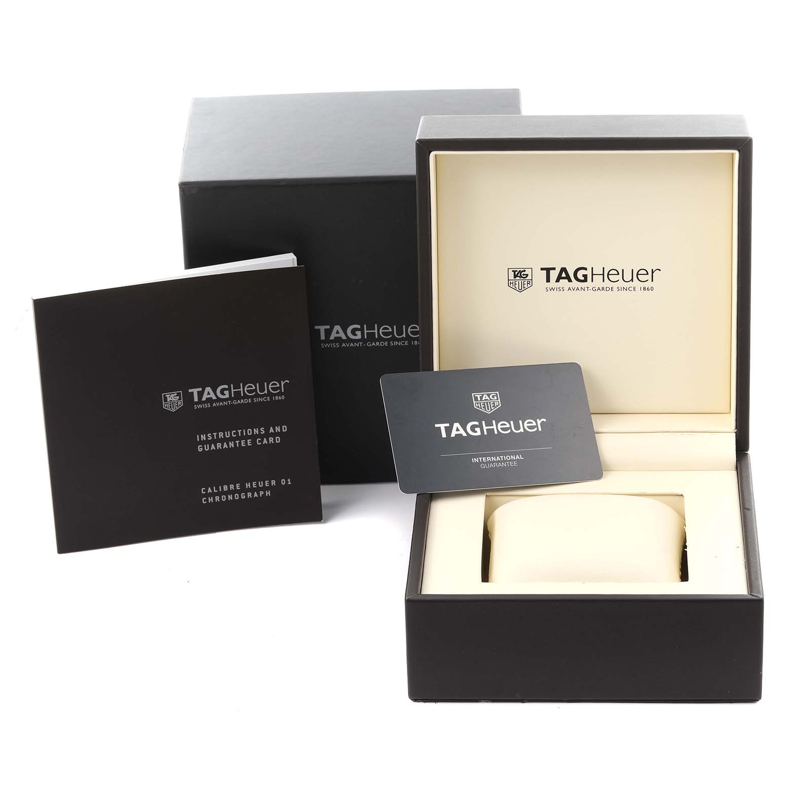 The image shows the packaging, warranty card, and instruction manual for a Tag Heuer Carrera CAR205A.FT6087 Men's Stainless Steel Transparent Dial CAR205A.FT6087 Men's Stainless Steel Transparent Dial watch.