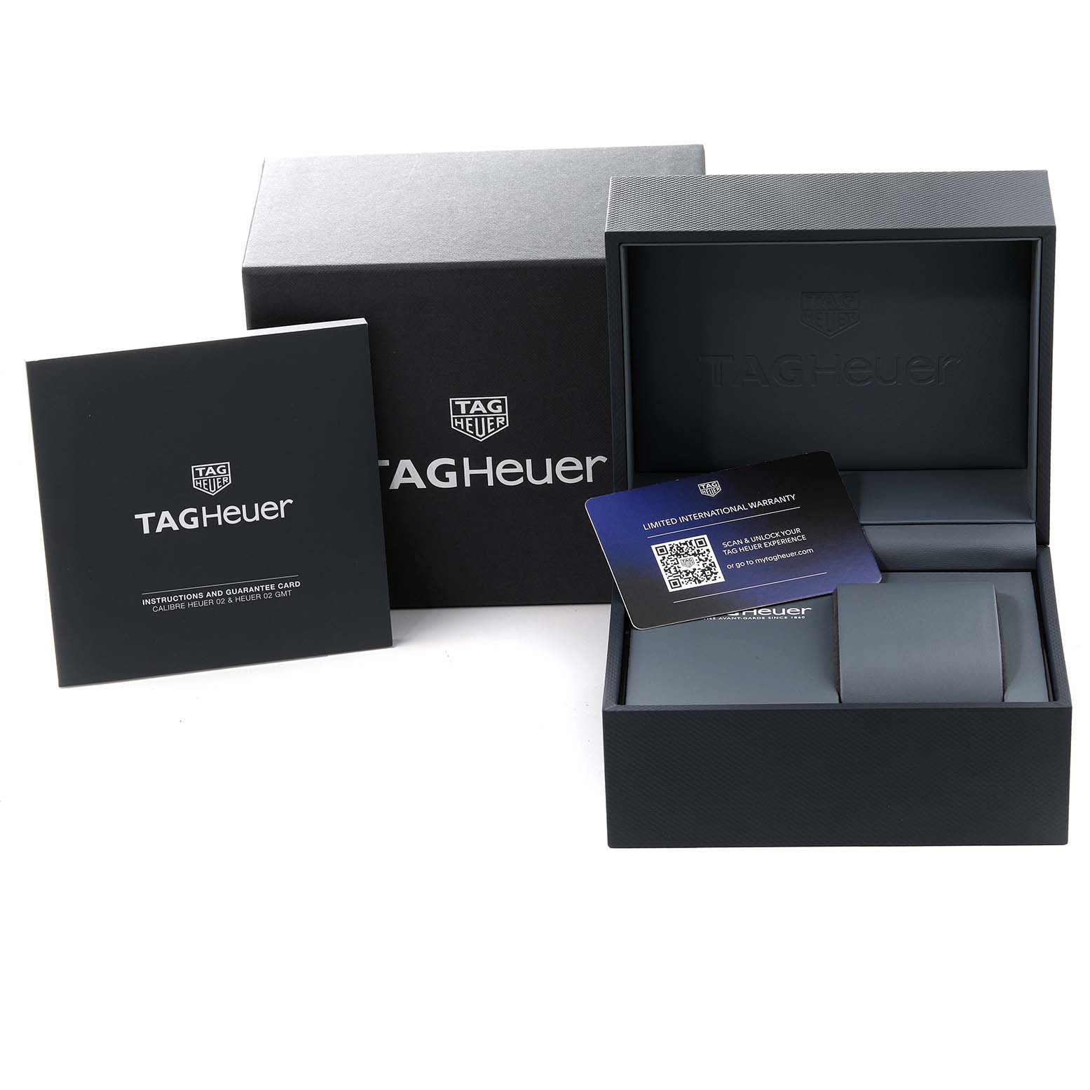 The image shows a Tag Heuer Carrera CBN2A1N.BA0643 Men's Stainless Steel Green Dial CBN2A1N.BA0643 Men's Stainless Steel Green Dial watch box, warranty card, and instruction booklet from a front angle.