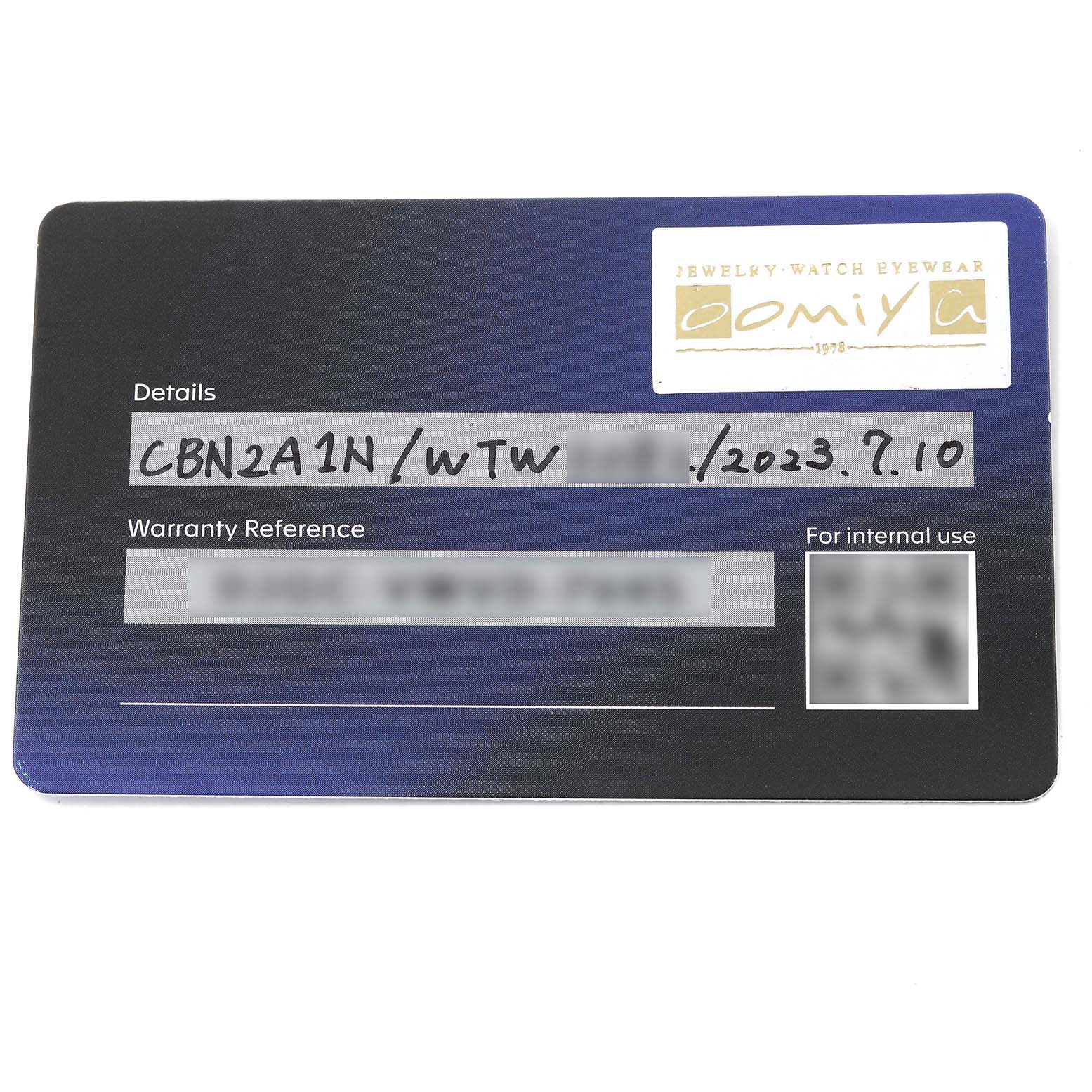 This image shows the warranty card for a Carrera model by Tag Heuer, displaying the date and model reference.