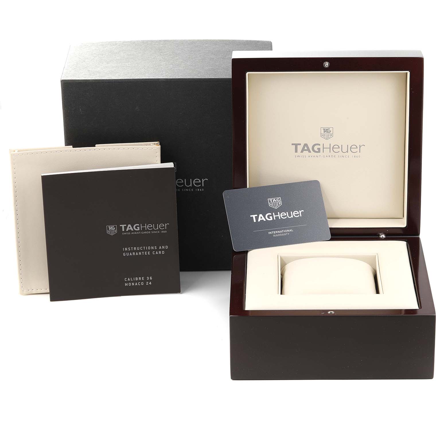 The image shows the Tag Heuer Monaco CAL5111.FC6299 Men's Stainless Steel Blue Dial CAL5111.FC6299 Men's Stainless Steel Blue Dial watch box, guarantee card, instruction booklet, and outer packaging from a front angle.