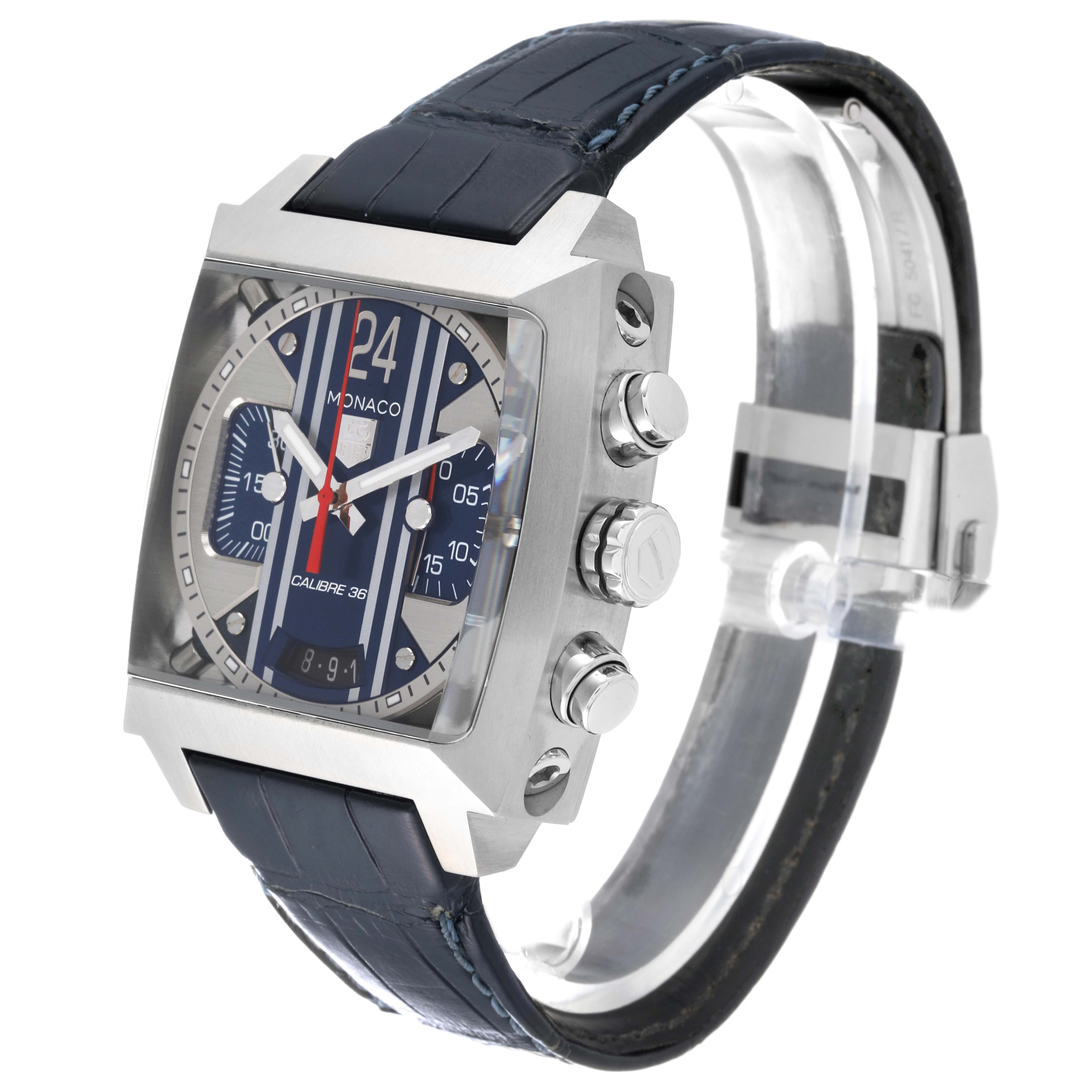 The image shows a side angle of the Tag Heuer Monaco CAL5111.FC6299 Men's Stainless Steel Blue Dial CAL5111.FC6299 Men's Stainless Steel Blue Dial watch, highlighting its square face, chronograph buttons, and leather strap.