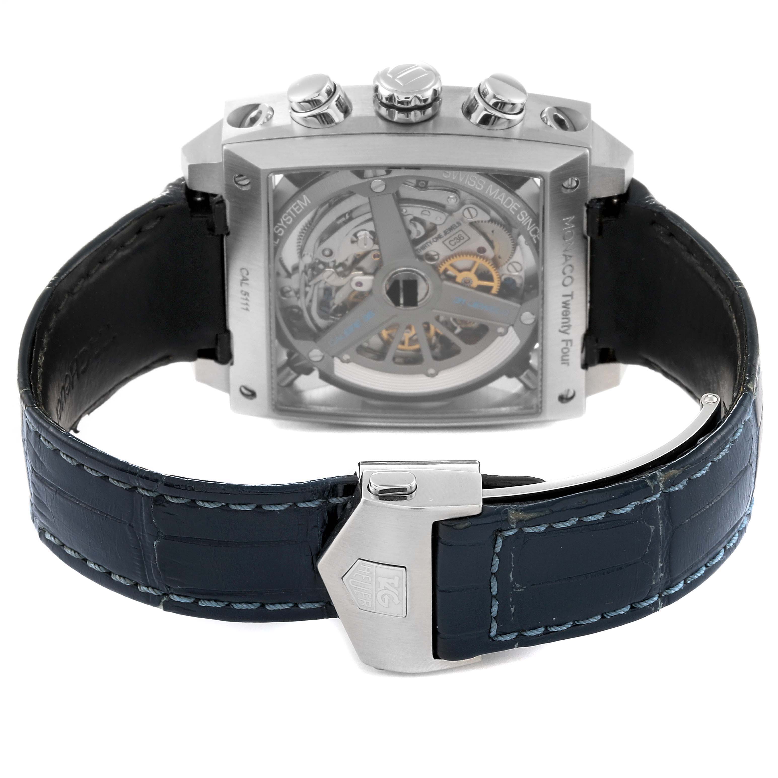 The image shows the back view of a Tag Heuer Monaco CAL5111.FC6299 Men's Stainless Steel Blue Dial CAL5111.FC6299 Men's Stainless Steel Blue Dial watch, highlighting its open case back and blue leather strap with Tag Heuer clasp.
