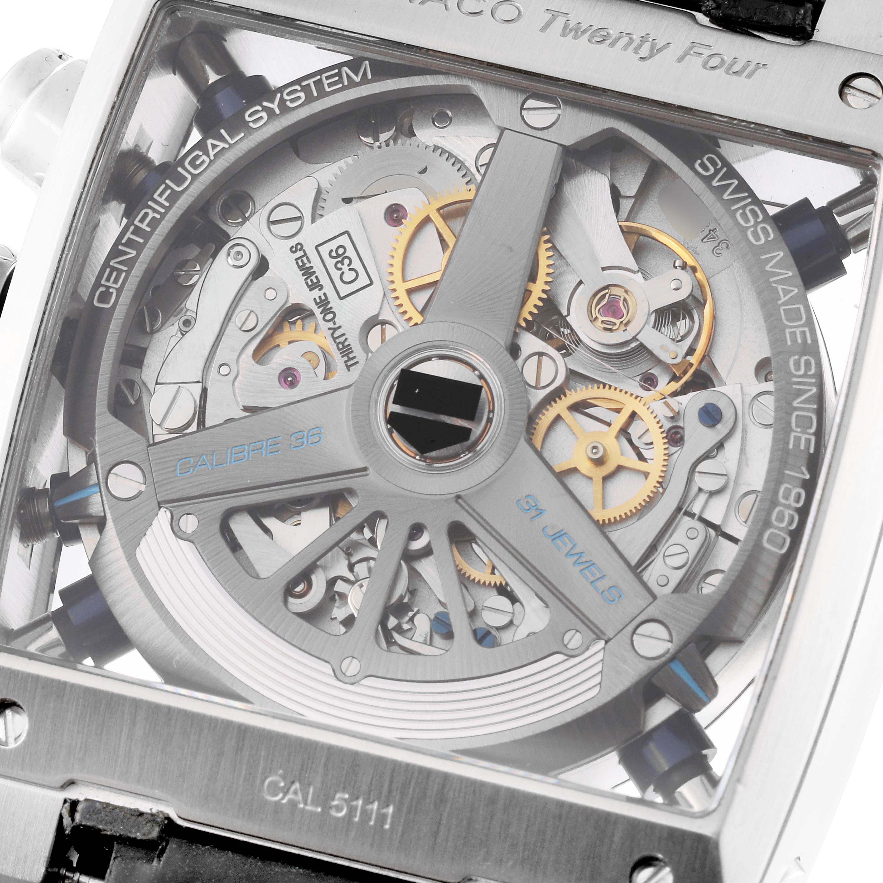 The image shows a close-up of the movement and internal mechanics of a Tag Heuer Monaco CAL5111.FC6299 Men's Stainless Steel Blue Dial CAL5111.FC6299 Men's Stainless Steel Blue Dial watch, revealing the Calibre 36 movement.