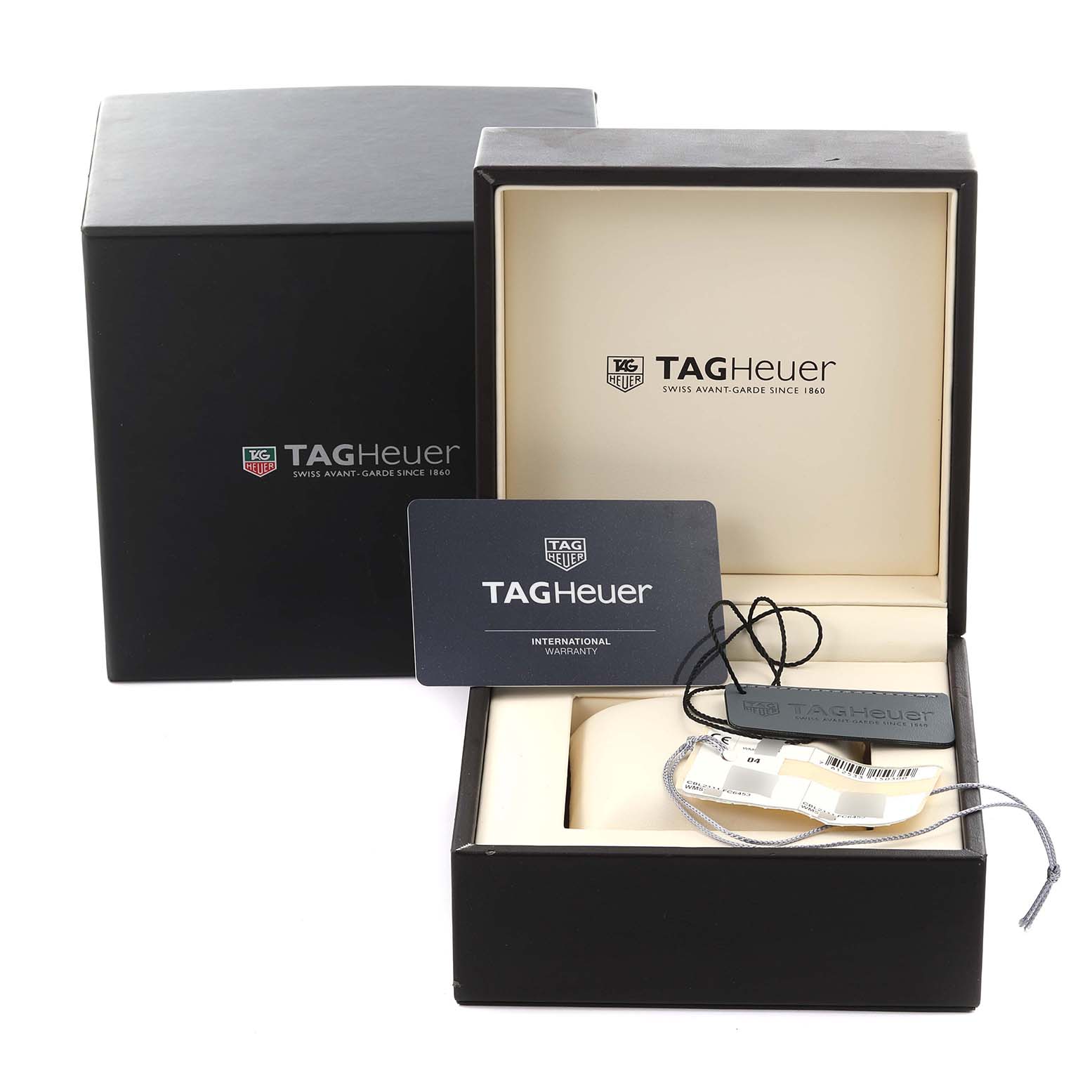 The image shows the Tag Heuer Monaco CBL2111.FC6453 Men's Stainless Steel Blue Dial CBL2111.FC6453 Men's Stainless Steel Blue Dial watch packaging, warranty card, and tags at a front angle.