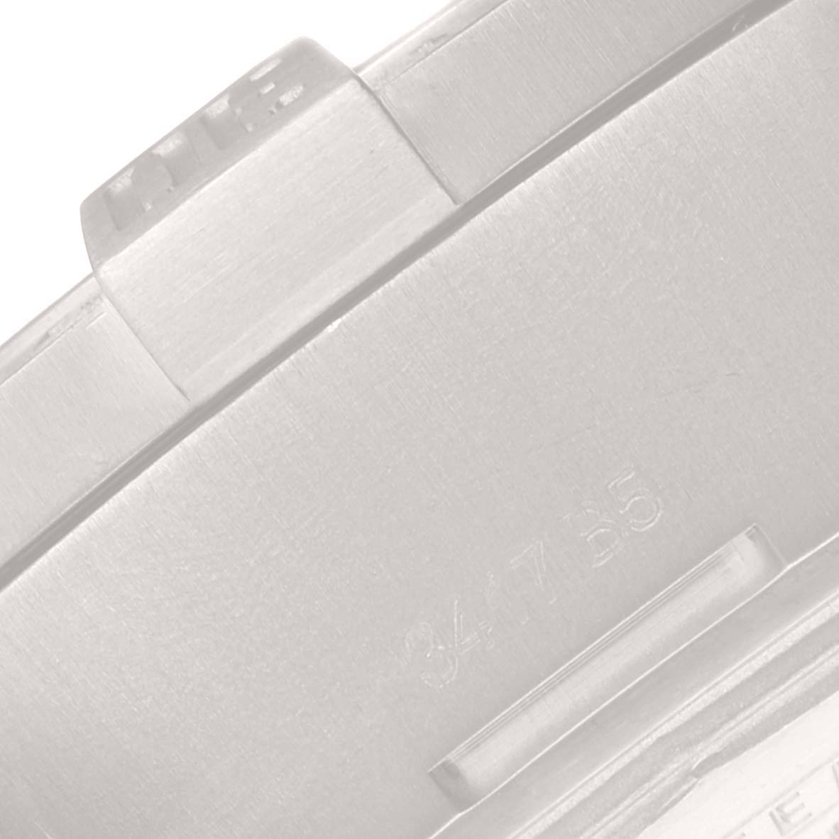 This image shows a close-up of the case back and part of the clasp of a Breitling Avenger E13383 Men's Titanium Grey Dial E13383 Men's Titanium Grey Dial watch.