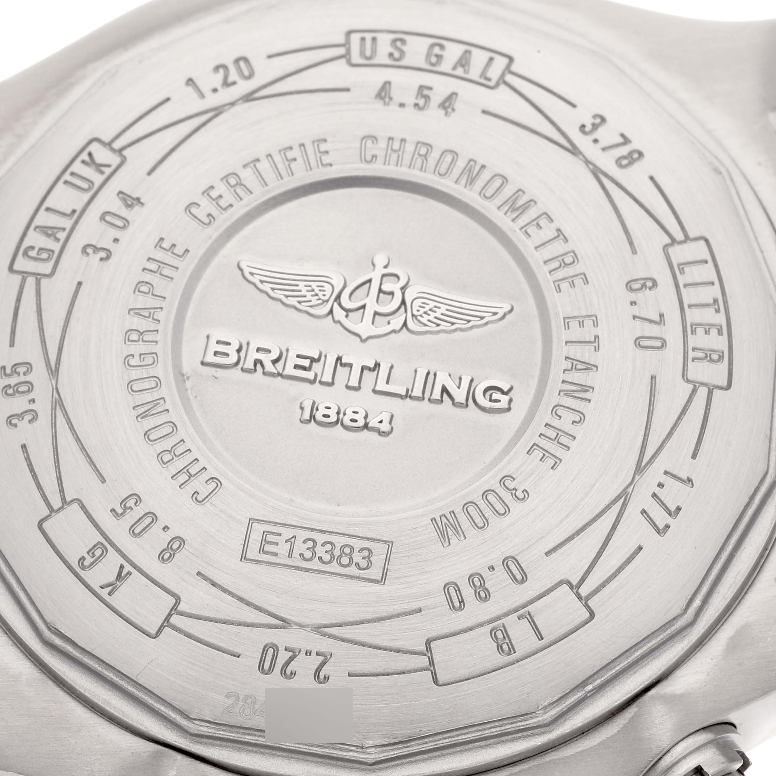 The image shows the case back of the Breitling Avenger E13383 Men's Titanium Grey Dial E13383 Men's Titanium Grey Dial watch, featuring inscriptions and conversion tables.