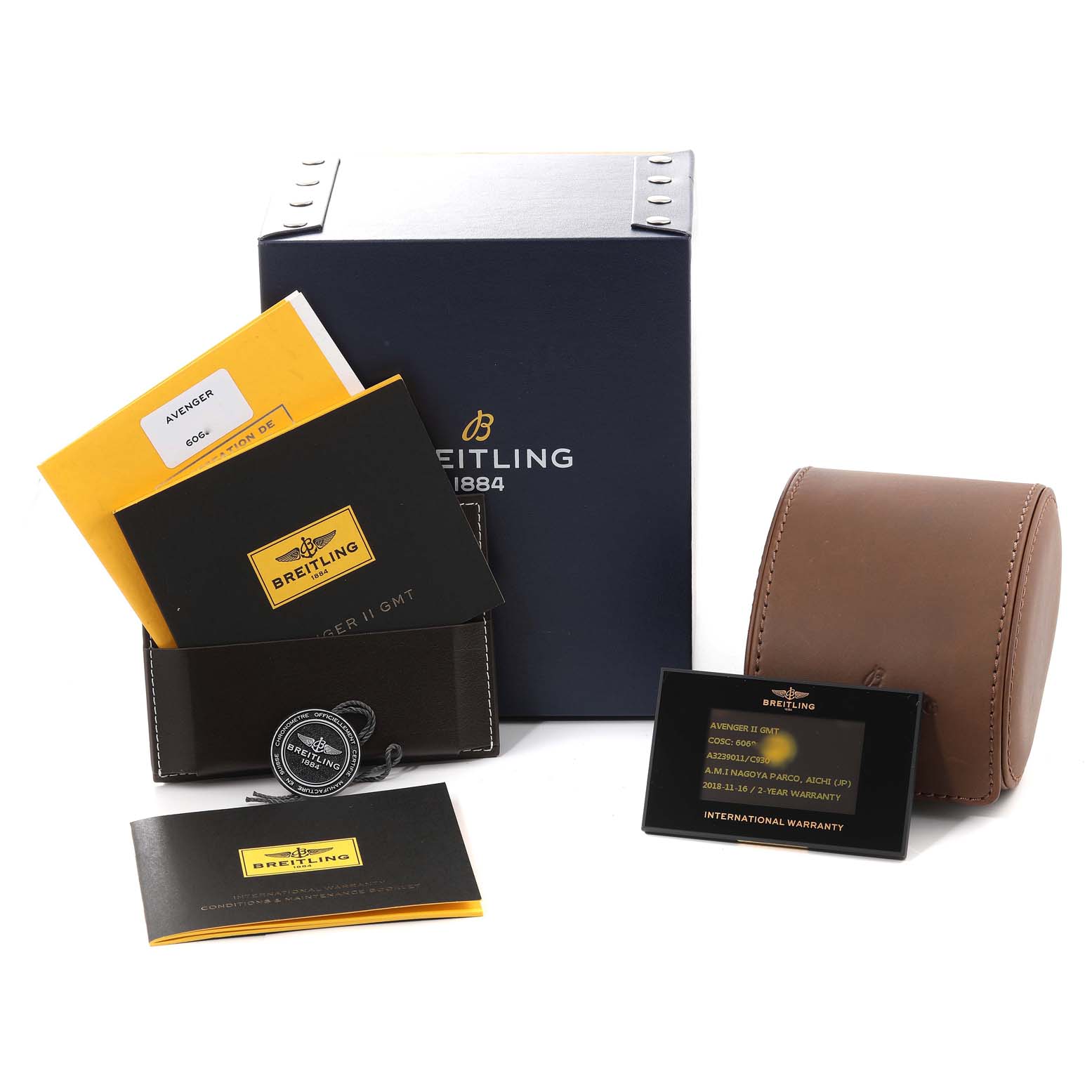 This image shows the box, warranty card, manuals, and a travel case for a Breitling Avenger A3239011/C930 Men's Stainless Steel Mother of Pearl Dial A3239011/C930 Men's Stainless Steel Mother of Pearl Dial watch.