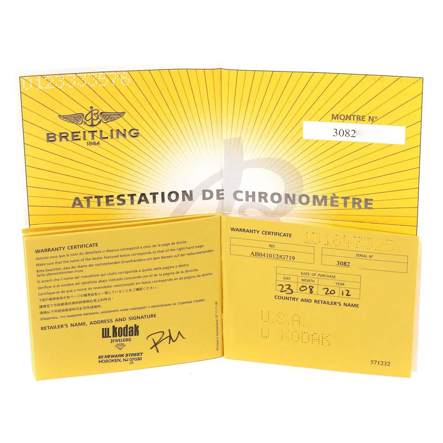 The image shows the warranty certificate and chronometer attestation for a Breitling Chronomat AB0410 Men
s Stainless Steel Silver Dial AB0410 Men
s Stainless Steel Silver Dial watch.