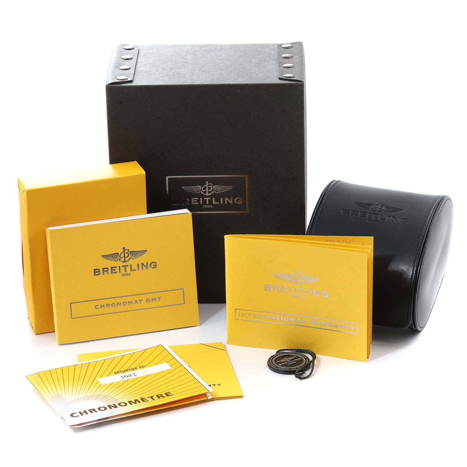 The image shows the packaging, boxes, booklets, and accessories for a Breitling Chronomat AB0410 Men
s Stainless Steel Silver Dial AB0410 Men
s Stainless Steel Silver Dial model watch from a front angle.