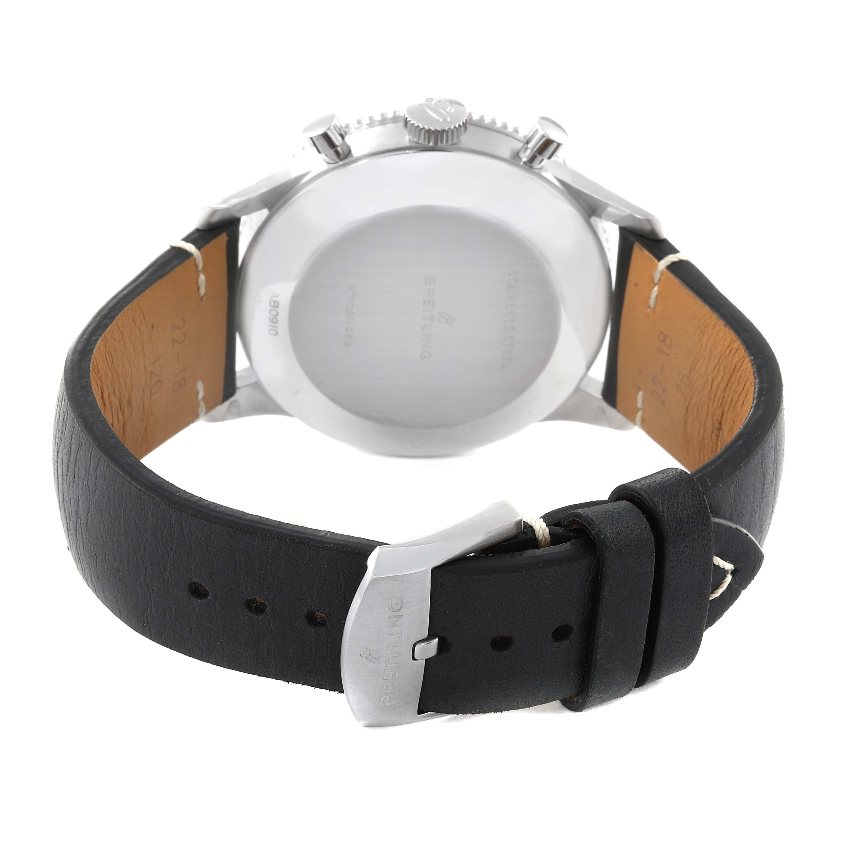 The image shows the back of a Breitling Navitimer AB0910371B1X1 Men's Stainless Steel Black Dial AB0910371B1X1 Men's Stainless Steel Black Dial watch with a black leather strap and an engraved buckle.