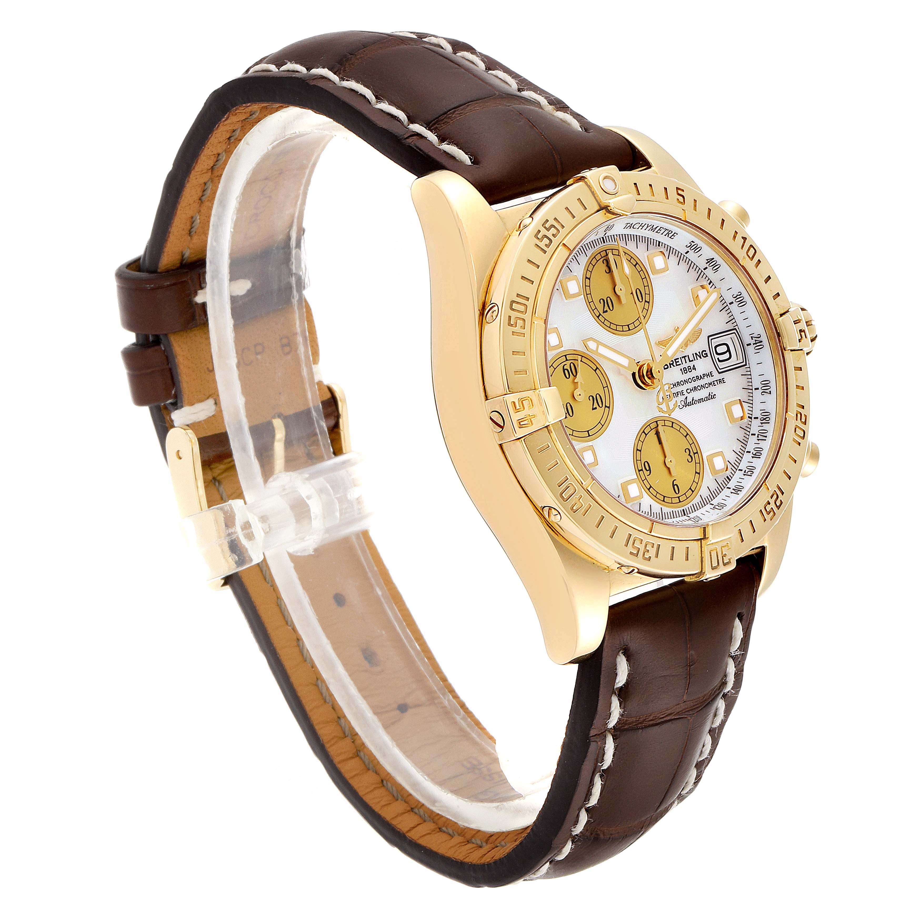The Breitling Windrider K13358 Men's Yellow Gold Mother of Pearl Dial K13358 Men's Yellow Gold Mother of Pearl Dial watch is shown at a three-quarter angle, displaying the face, bezel, and leather strap.