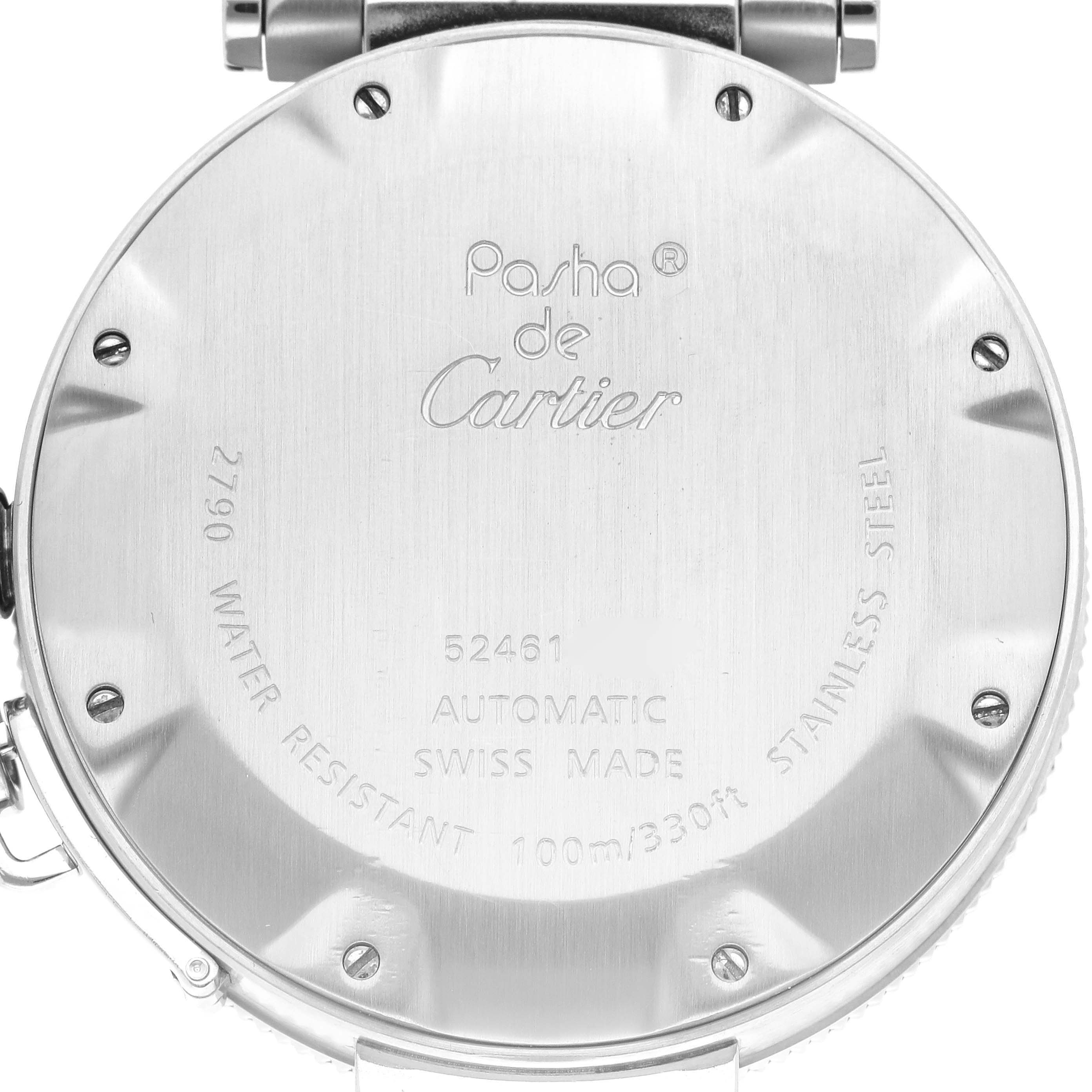 The image shows the back case of a Cartier Pasha W31077M7 Men's Stainless Steel Black Dial W31077M7 Men's Stainless Steel Black Dial watch, displaying its engraved details and screws.