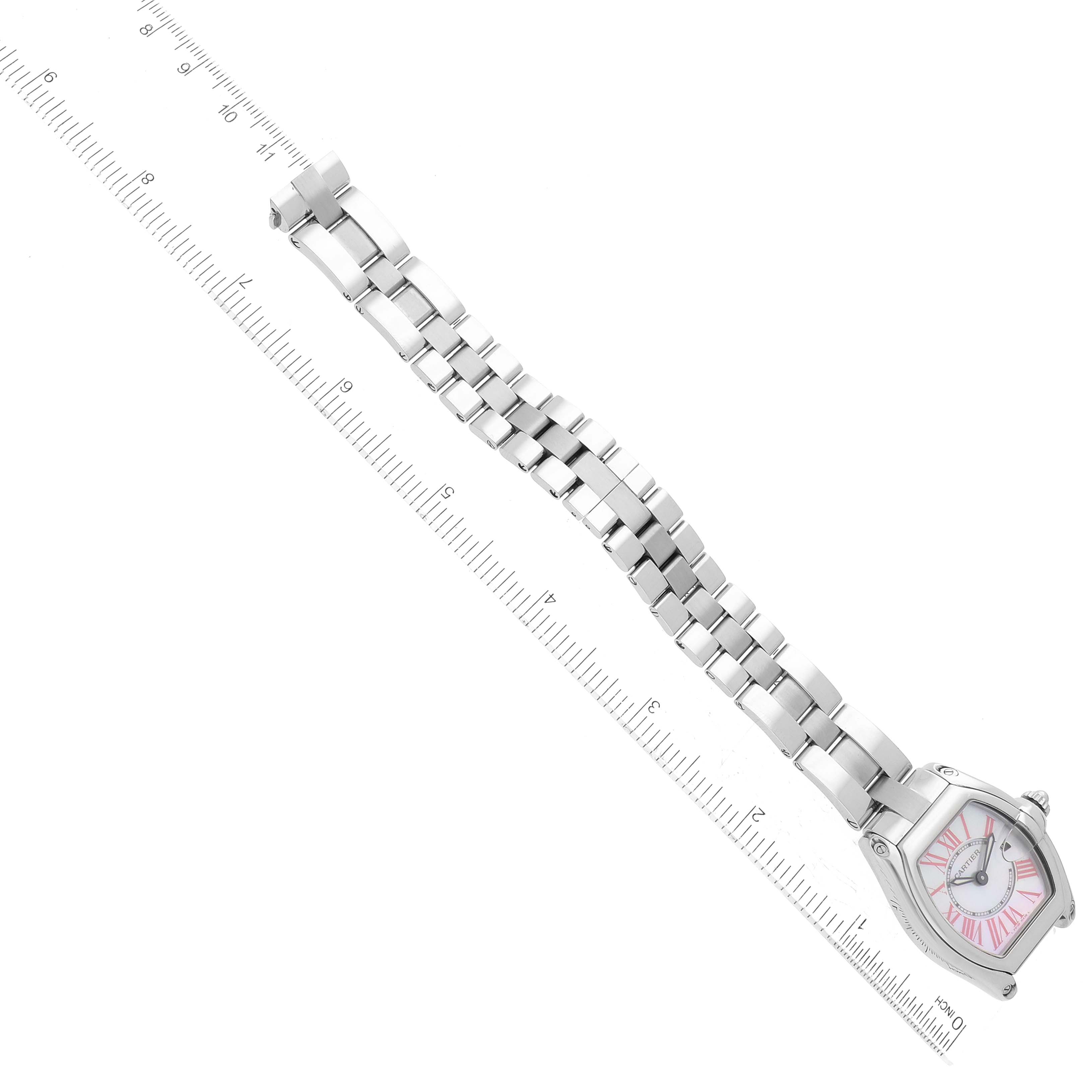 The image displays a Cartier Roadster W6206006 Women's Stainless Steel Mother of Pearl Dial W6206006 Women's Stainless Steel Mother of Pearl Dial watch laid flat with its strap extended alongside a measurement ruler.