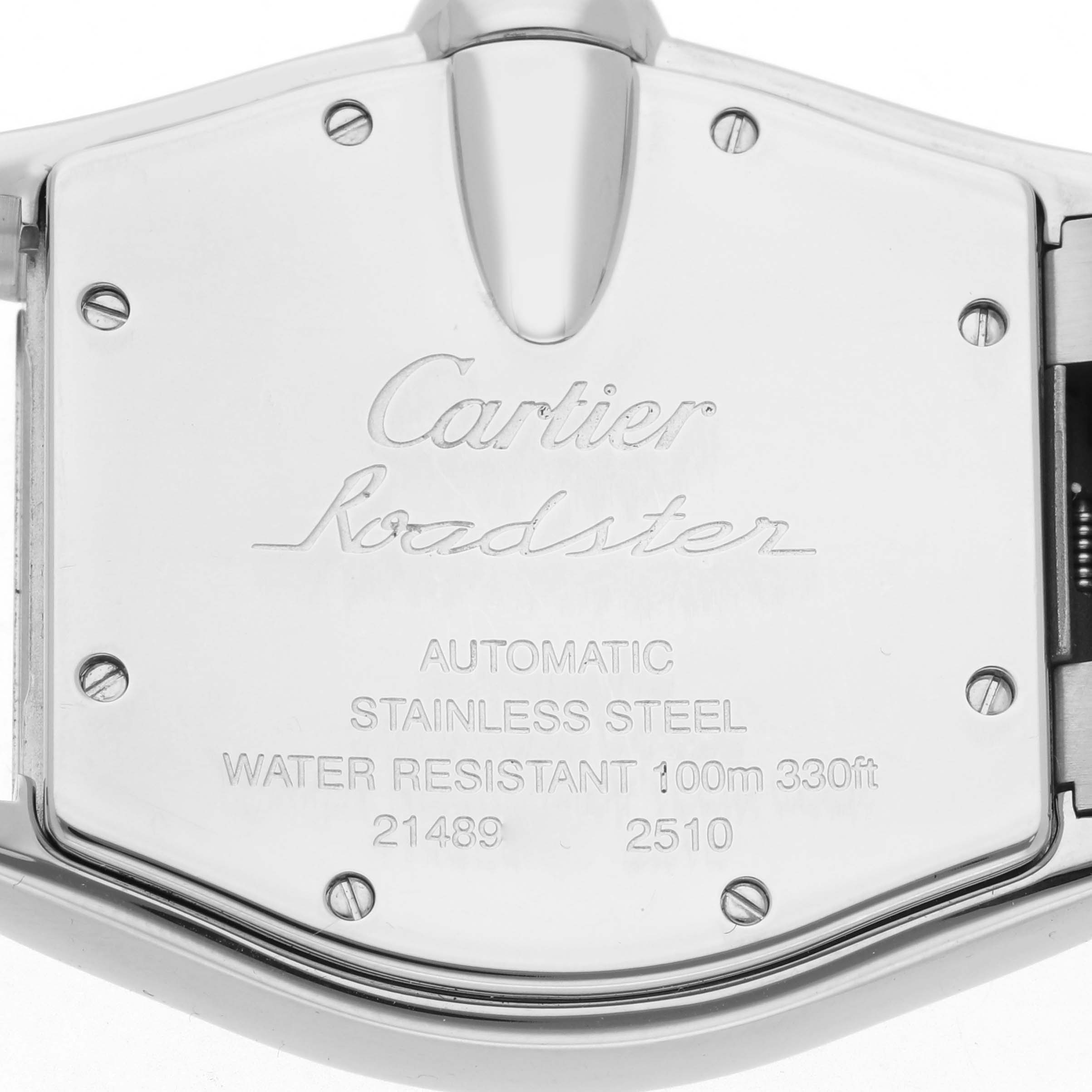 The image shows the back case of a Cartier Roadster W62002V3 Men's Stainless Steel Black Dial W62002V3 Men's Stainless Steel Black Dial watch, highlighting its inscription and fastening screws.