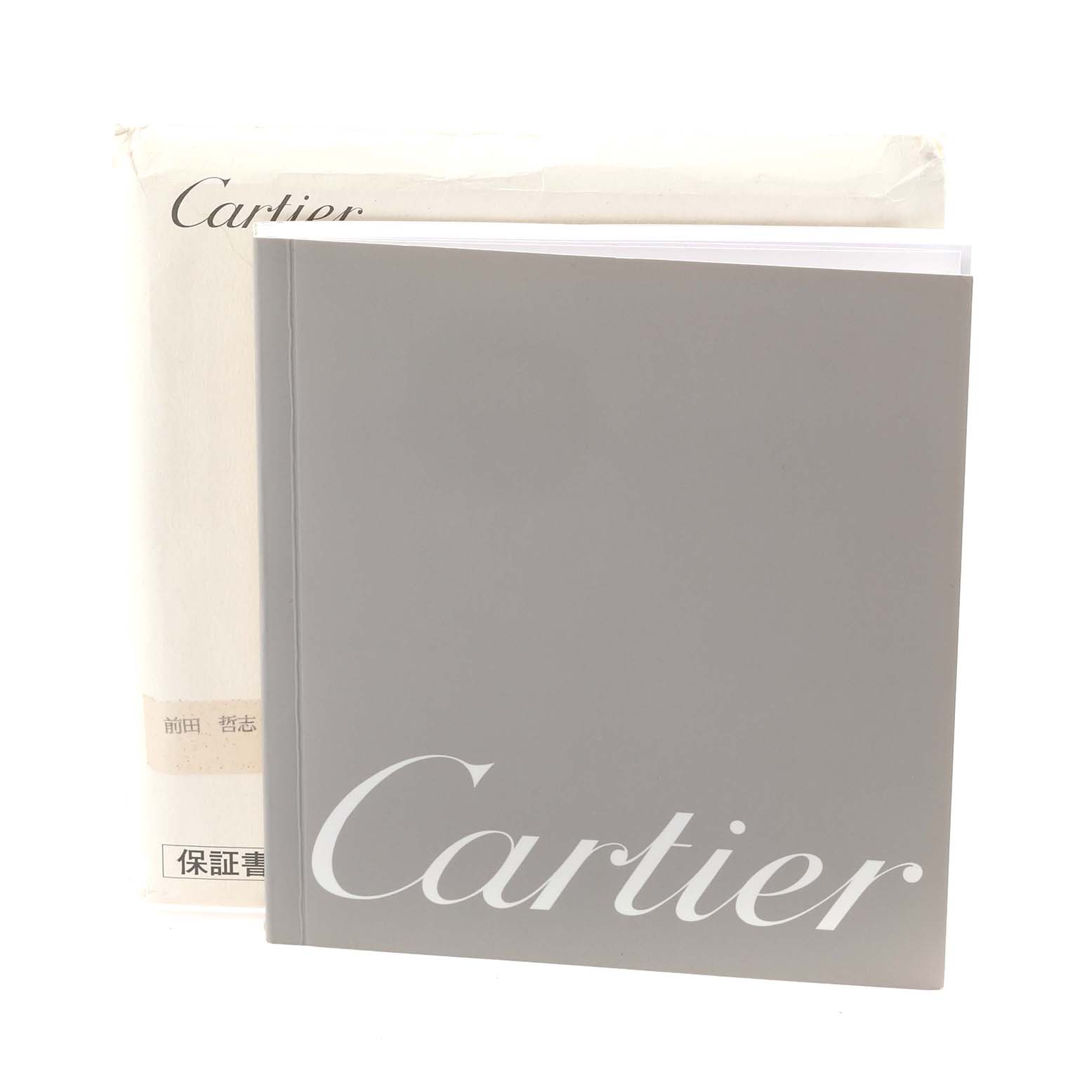 The image shows a Cartier Roadster W62002V3 Men's Stainless Steel Black Dial W62002V3 Men's Stainless Steel Black Dial booklet and a warranty card, viewed from the front.
