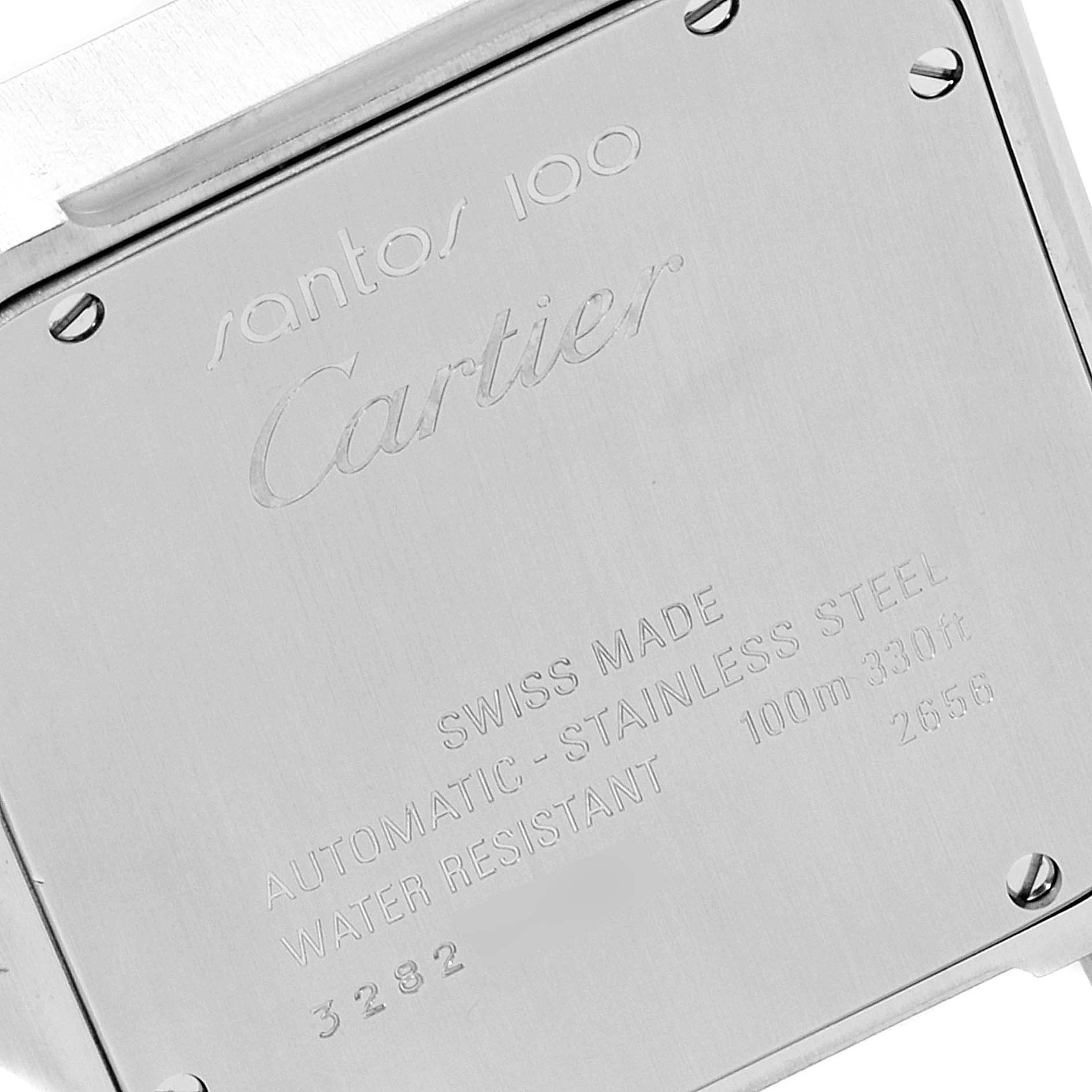 The image shows the back case of a Santos model by Cartier, displaying engravings and screw details.