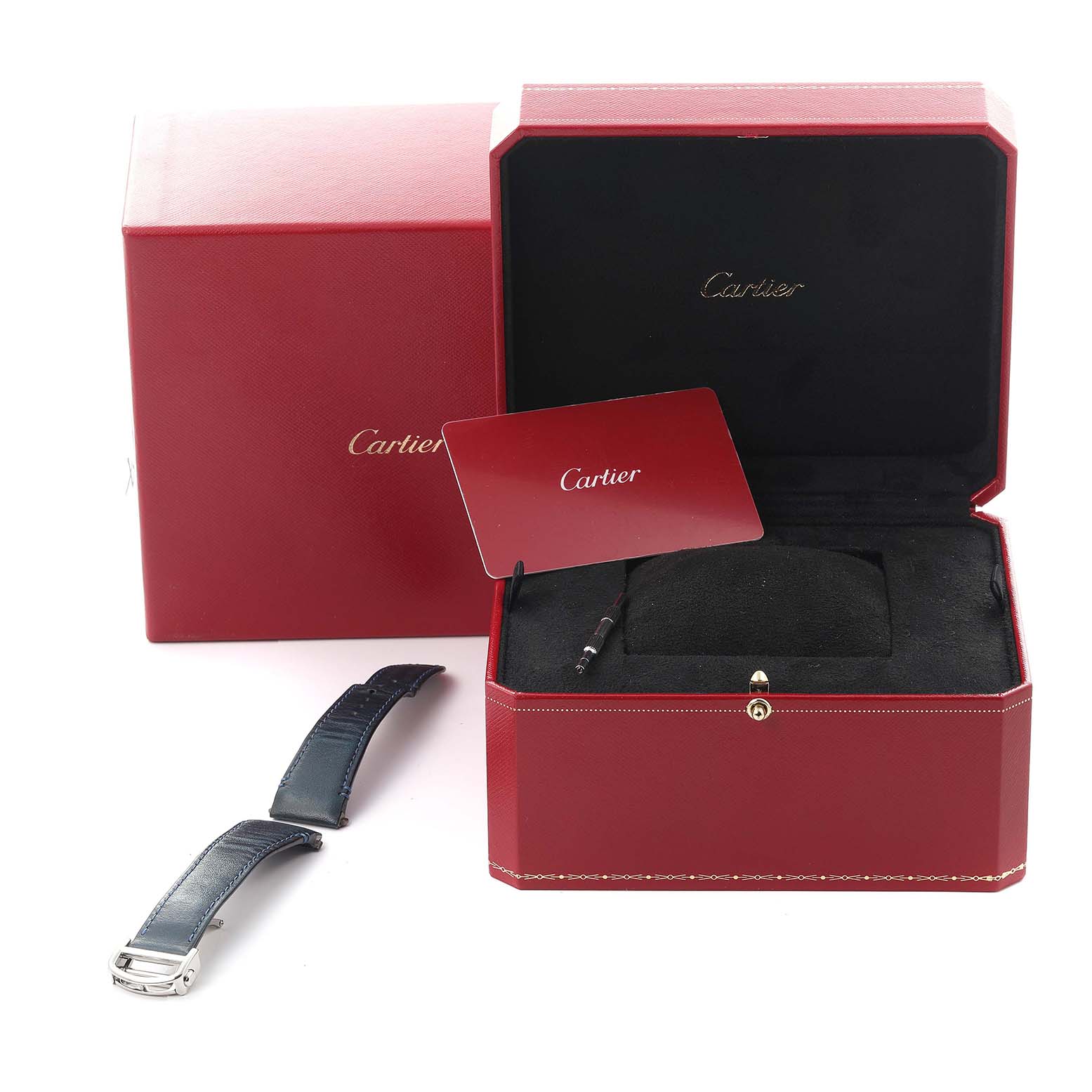 The image shows a Cartier Santos WSSA0030 Men's Stainless Steel Blue Dial WSSA0030 Men's Stainless Steel Blue Dial watch box with a card, interior cushion, and an additional leather strap visible.