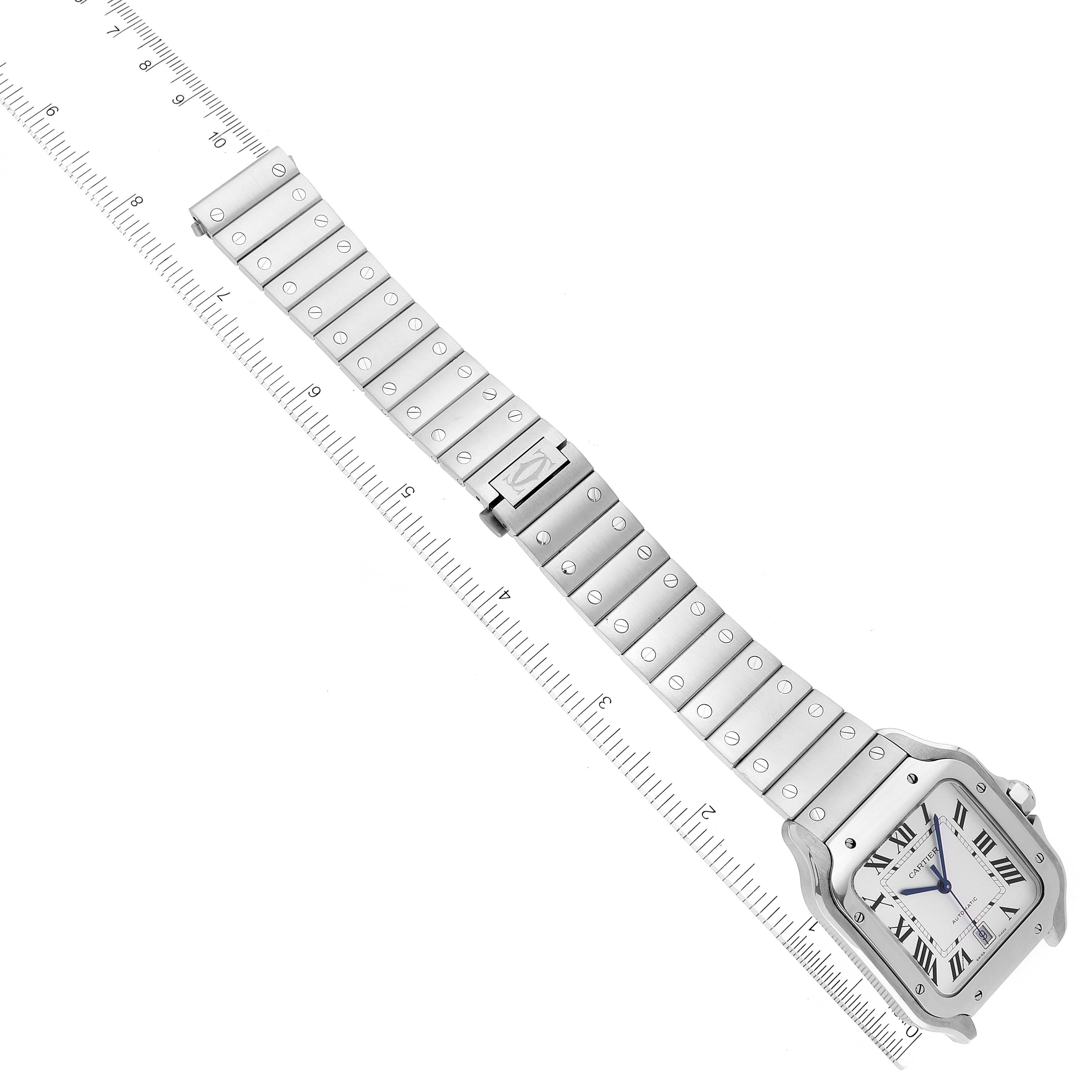 The image shows an overhead view of a Cartier Santos WSSA0018 Men
s Stainless Steel Silver Dial WSSA0018 Men
s Stainless Steel Silver Dial watch with its full stainless steel bracelet laid flat.