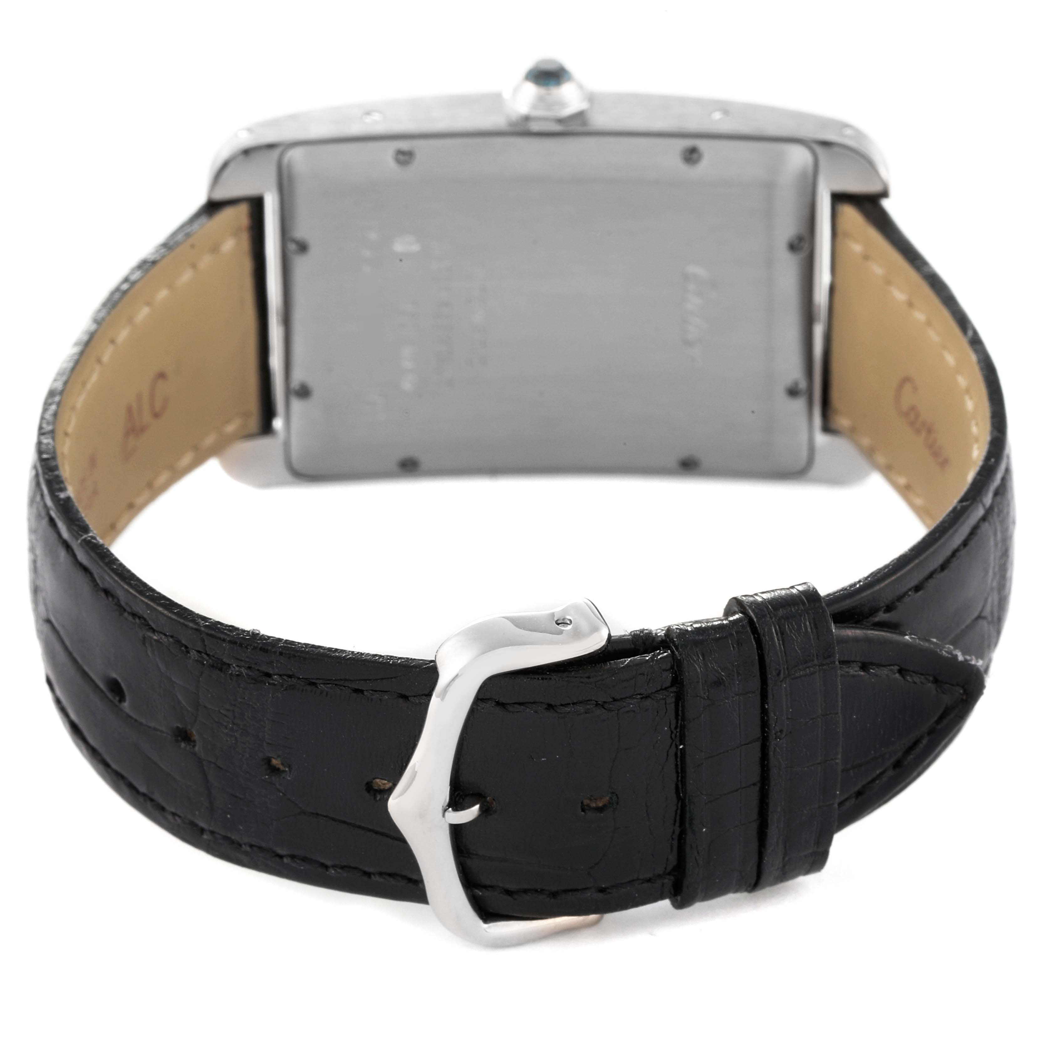 This image shows the back view of a Cartier Tank Americaine W2603256 Men's White Gold Silver Dial W2603256 Men's White Gold Silver Dial watch, highlighting its buckle and leather strap.