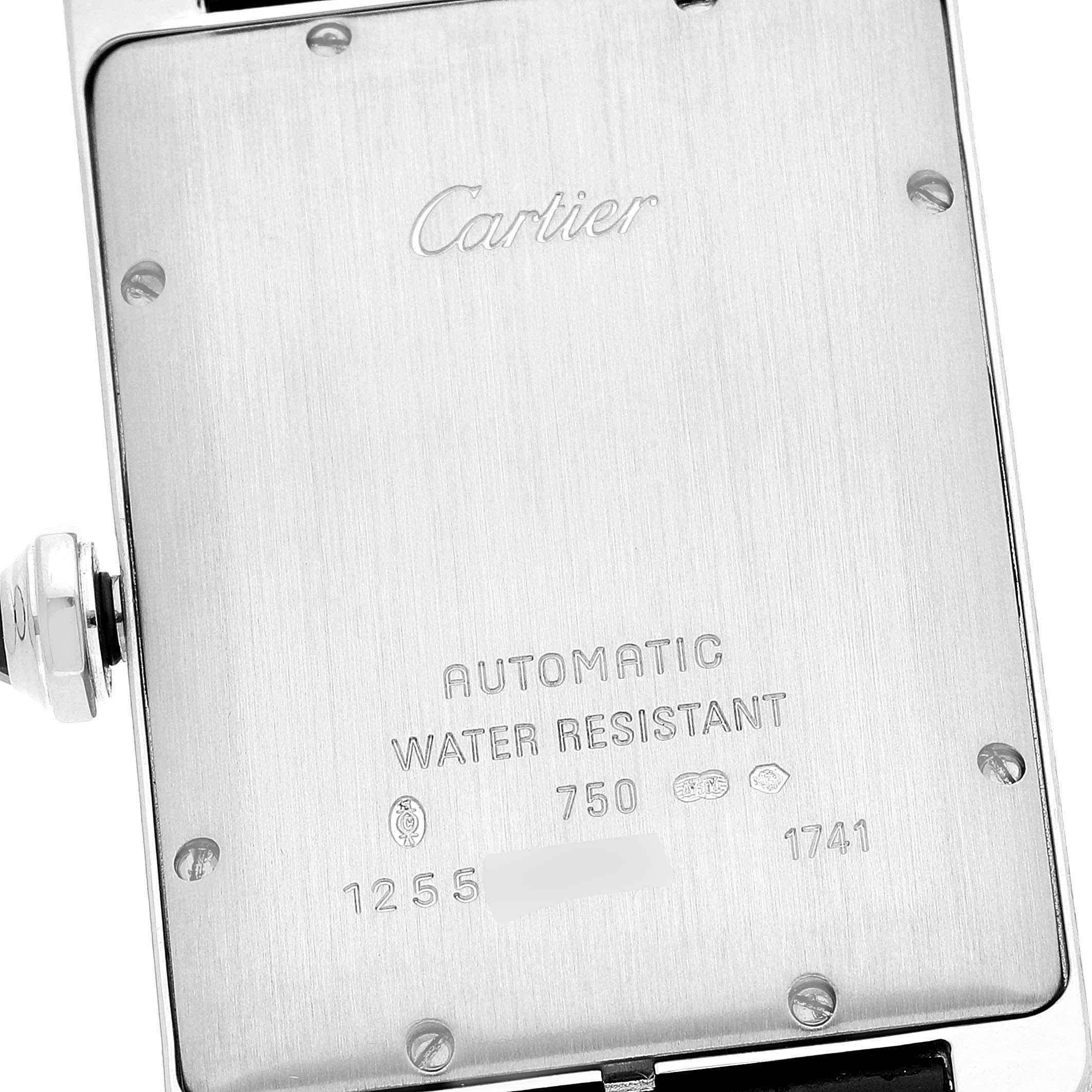 The image shows the back case of a Cartier Tank Americaine W2603256 Men's White Gold Silver Dial W2603256 Men's White Gold Silver Dial watch, displaying engravings and markings.