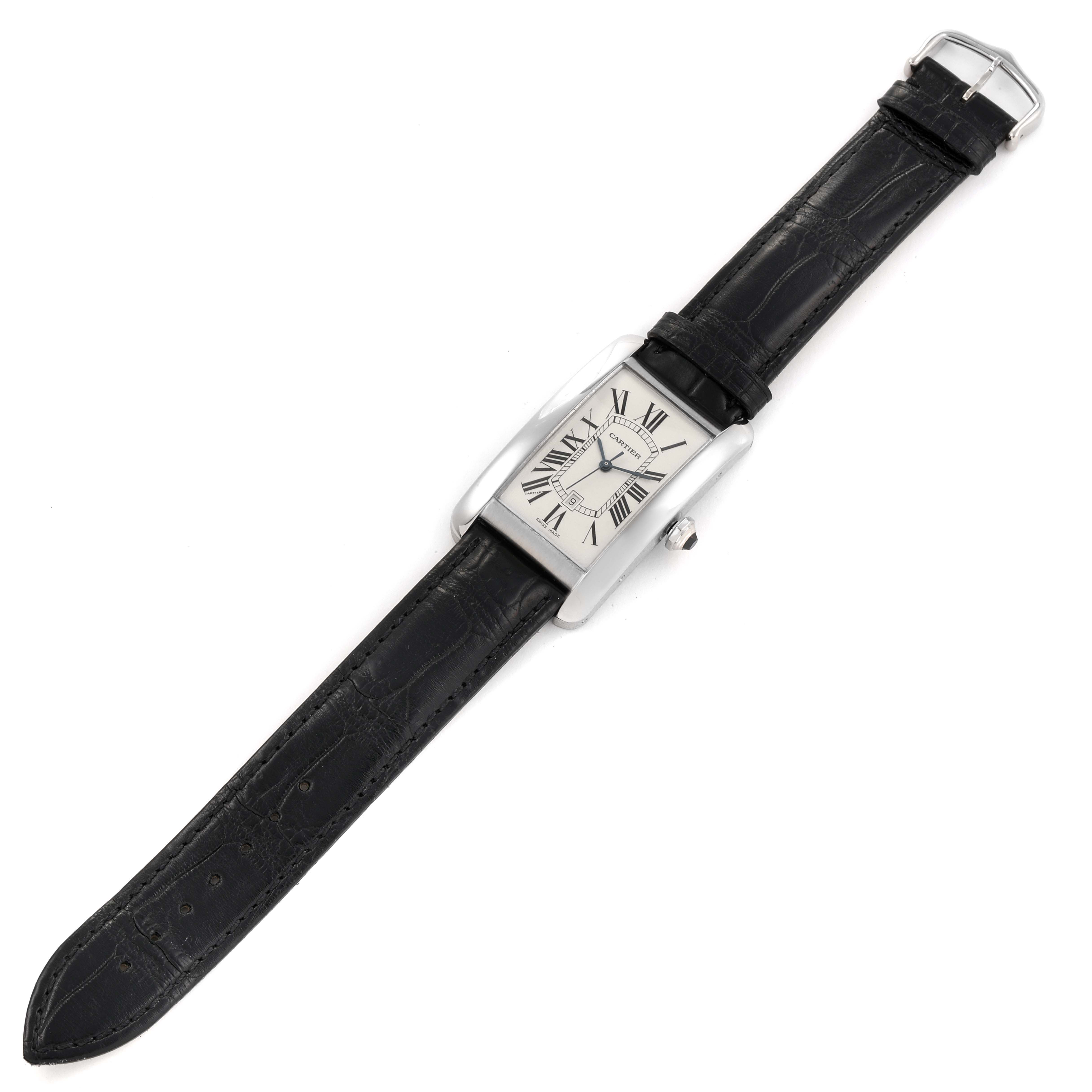 The image shows a Cartier Tank Americaine W2603256 Men's White Gold Silver Dial W2603256 Men's White Gold Silver Dial watch with a black leather strap, seen from a top-down perspective.