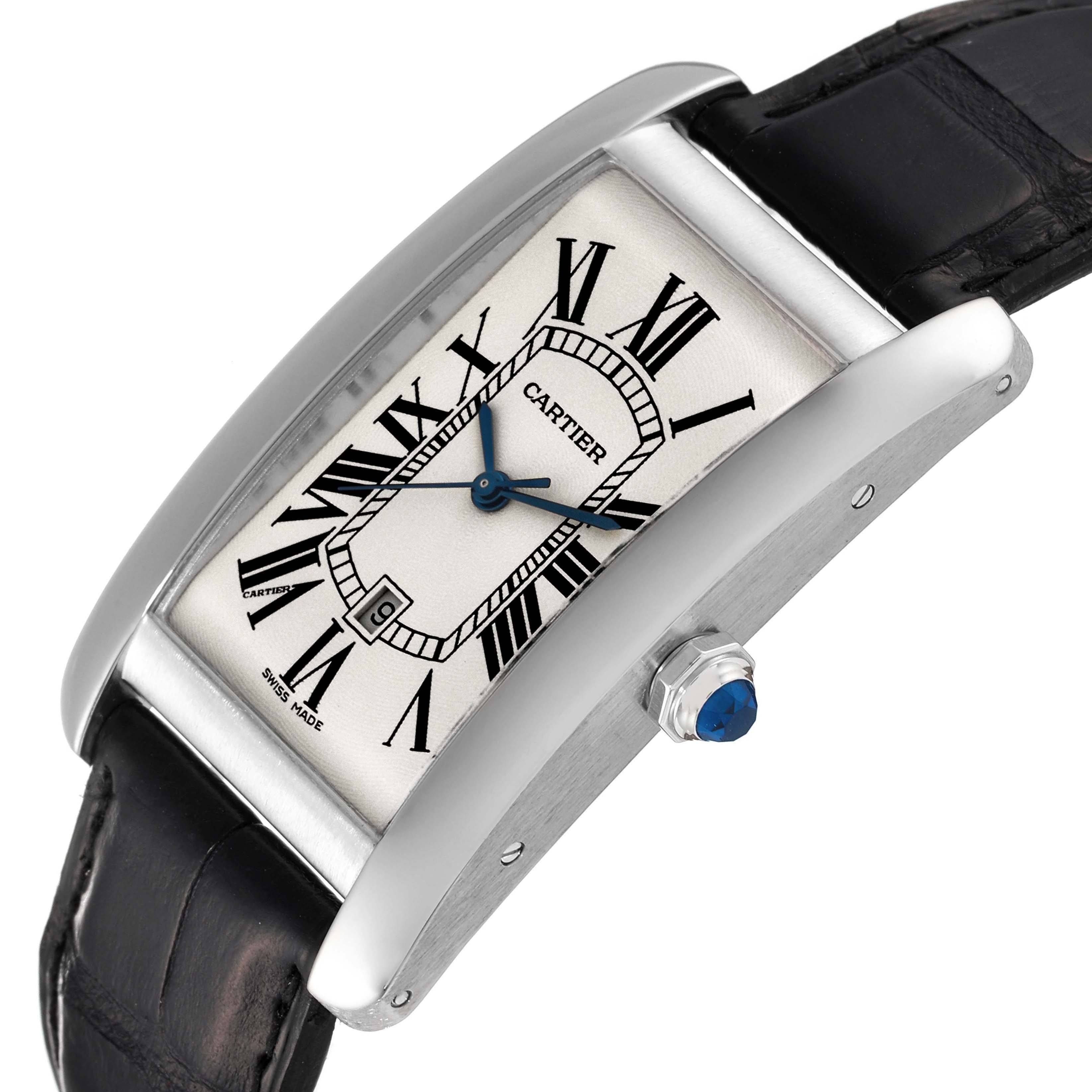 The image shows a Cartier Tank Americaine W2603256 Men's White Gold Silver Dial W2603256 Men's White Gold Silver Dial watch at a slight angle, highlighting the face, blue hands, crown, and part of the black strap.