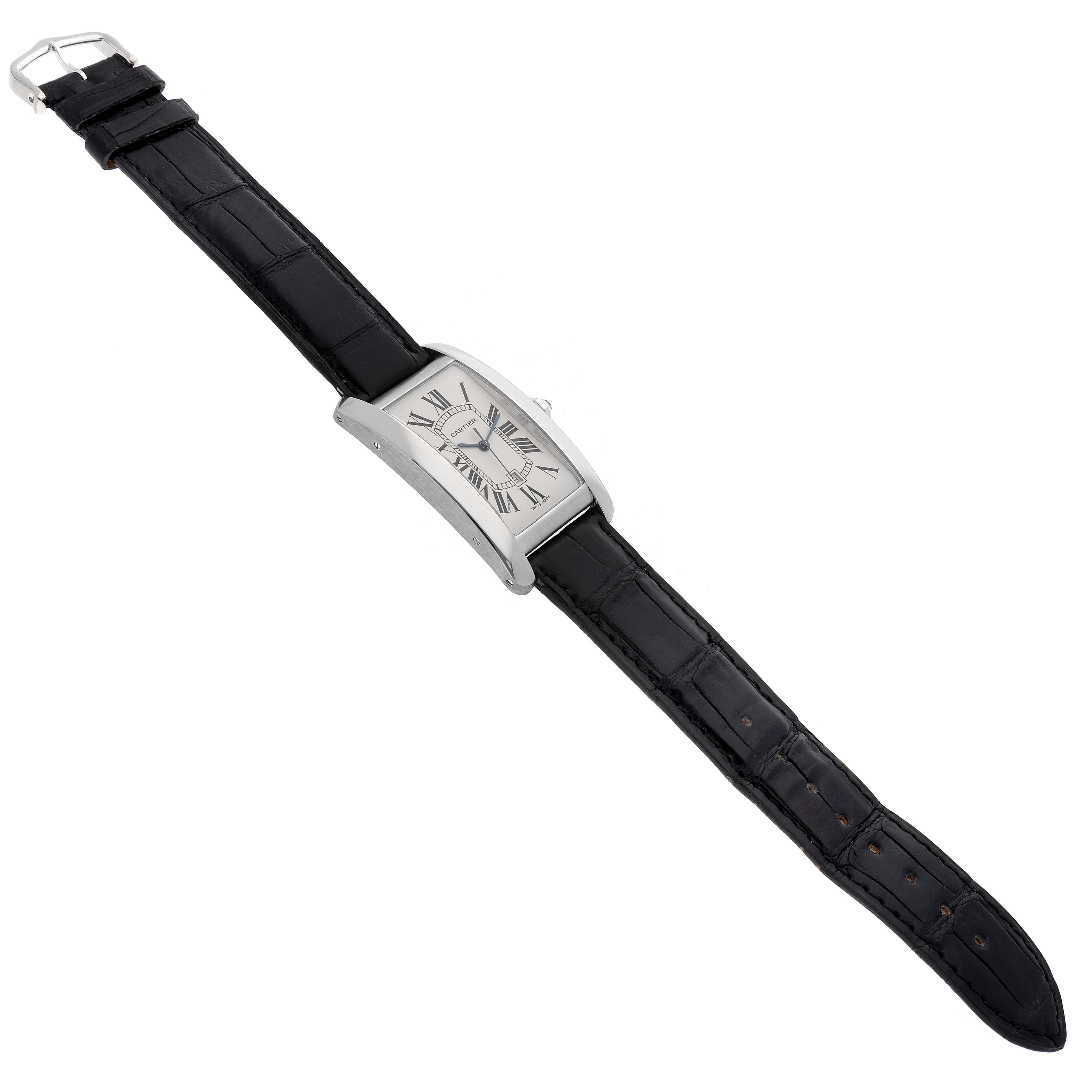 The Cartier Tank Americaine W2603256 Men's White Gold Silver Dial W2603256 Men's White Gold Silver Dial watch is shown from an overhead angle, displaying its rectangular case, white dial, and black leather strap.