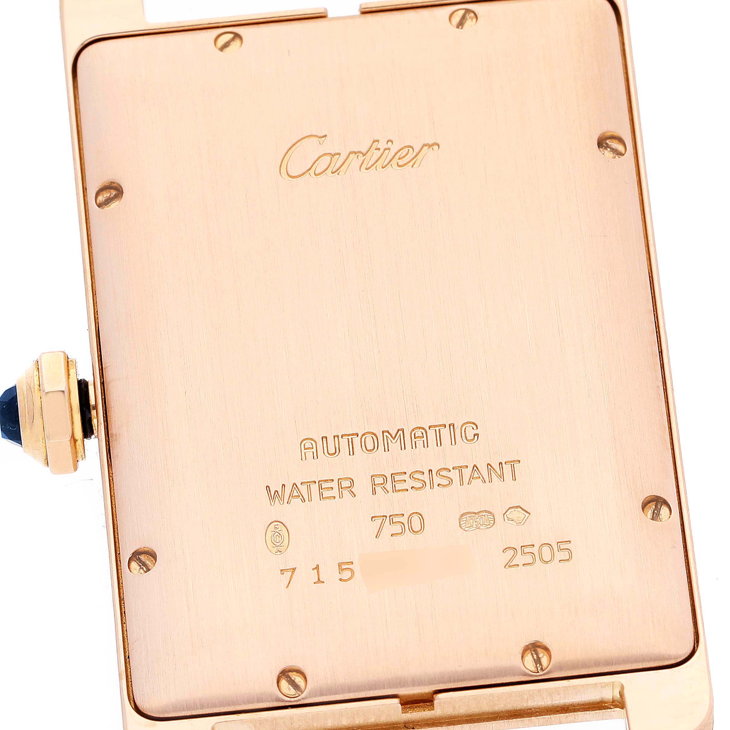 This image shows the back case of a Tank Americaine watch by Cartier, with inscriptions and a side view of the crown.