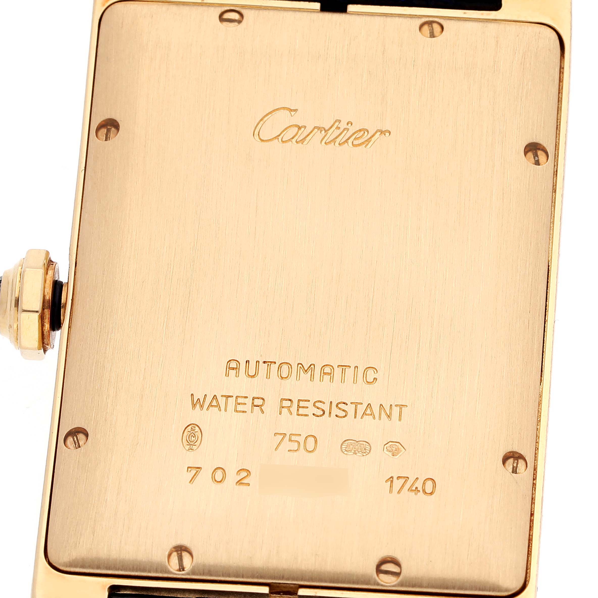 This image shows the back of the Cartier Tank Americaine W2603156 Men's Yellow Gold Silver Dial W2603156 Men's Yellow Gold Silver Dial watch, displaying its screw-down case and engraving details.