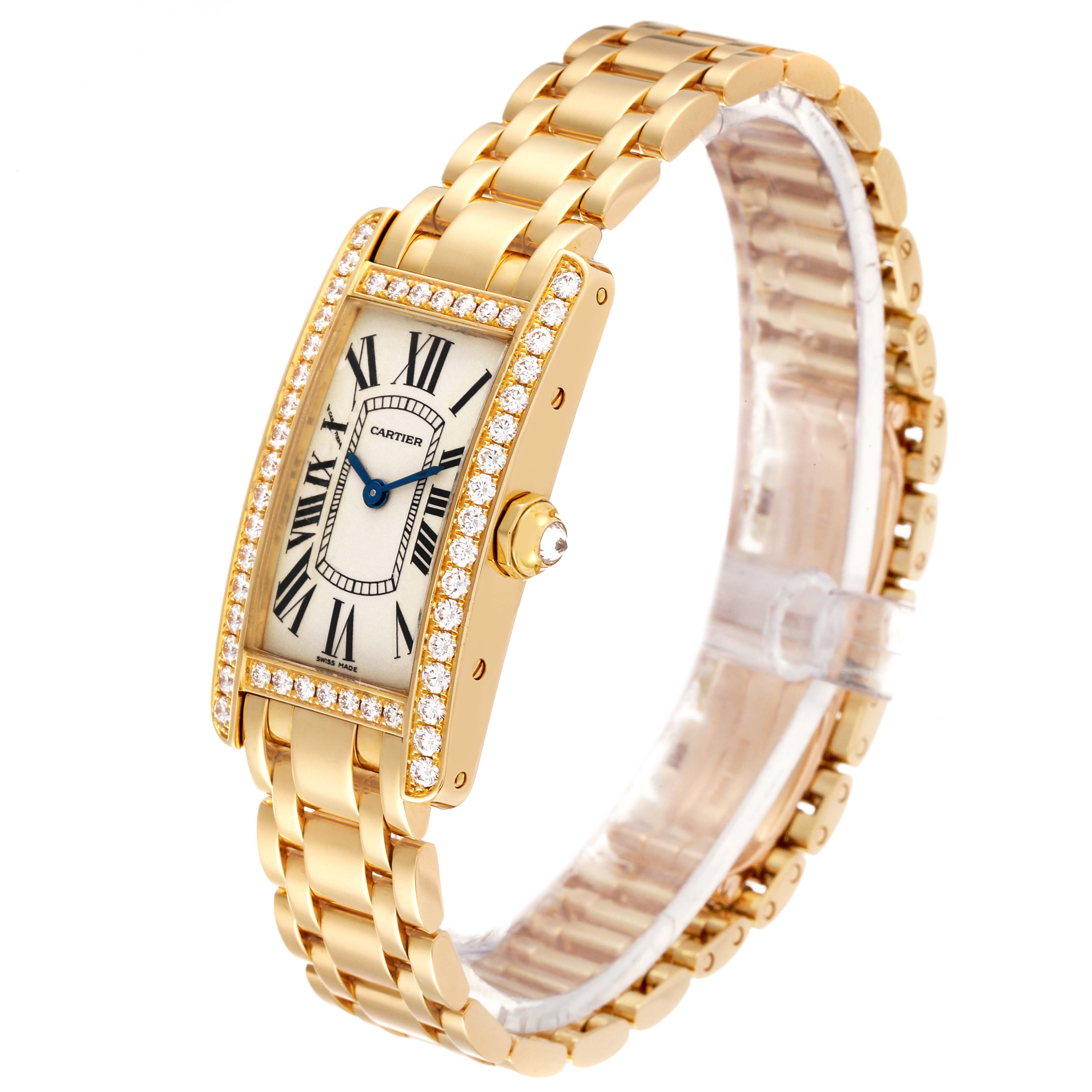 The Cartier Tank Americaine WB7072K2 Women's Yellow Gold Silver Dial WB7072K2 Women's Yellow Gold Silver Dial watch is shown at an angled side view, highlighting its gold bracelet and diamond-studded rectangular case.