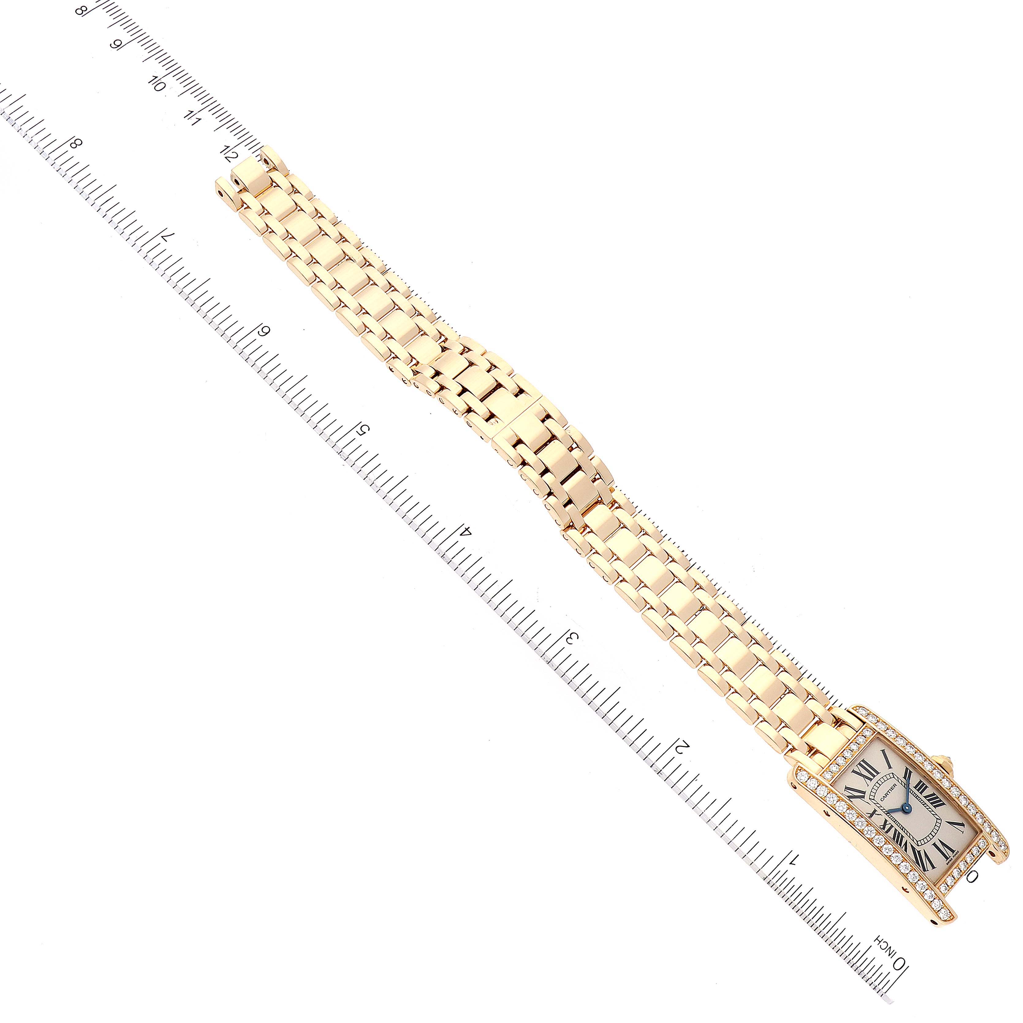 The Cartier Tank Americaine WB7072K2 Women's Yellow Gold Silver Dial WB7072K2 Women's Yellow Gold Silver Dial watch is shown from a top-down angle, displaying its face and entire bracelet.