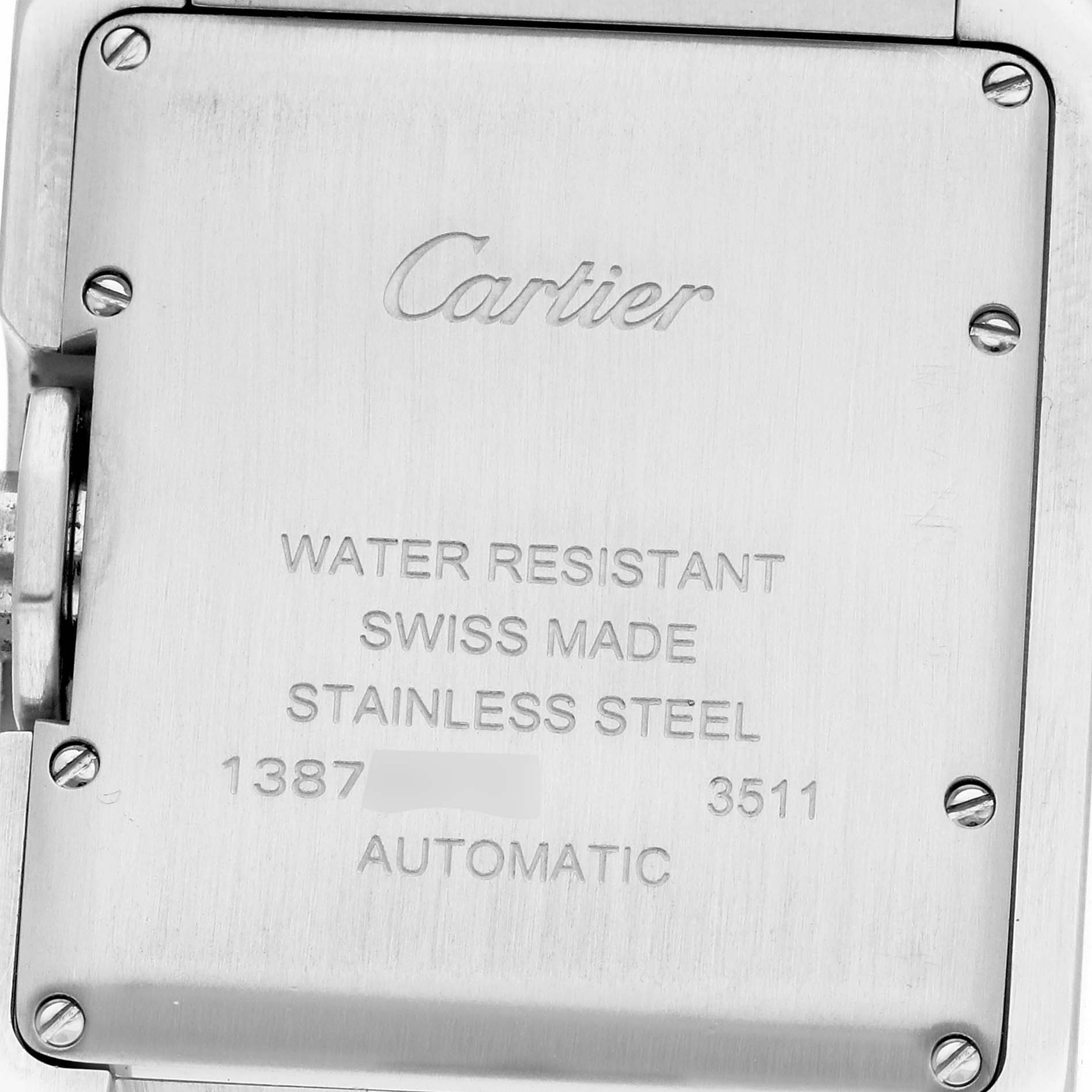 The image shows the back case of a Cartier Tank Anglaise W5310009 Men's Stainless Steel Silver Dial W5310009 Men's Stainless Steel Silver Dial watch, featuring engraved details and screws.