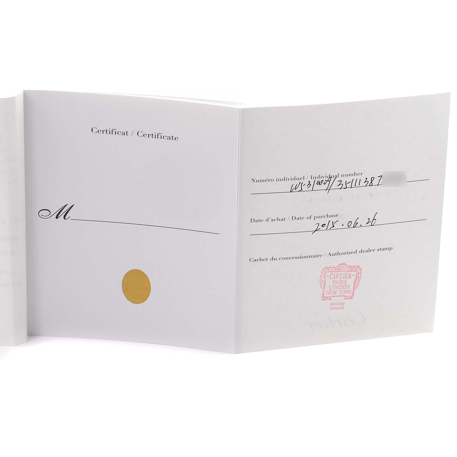 The image shows the certificate or warranty booklet for the Cartier Tank Anglaise W5310009 Men's Stainless Steel Silver Dial W5310009 Men's Stainless Steel Silver Dial watch, featuring purchase details and a dealer stamp.