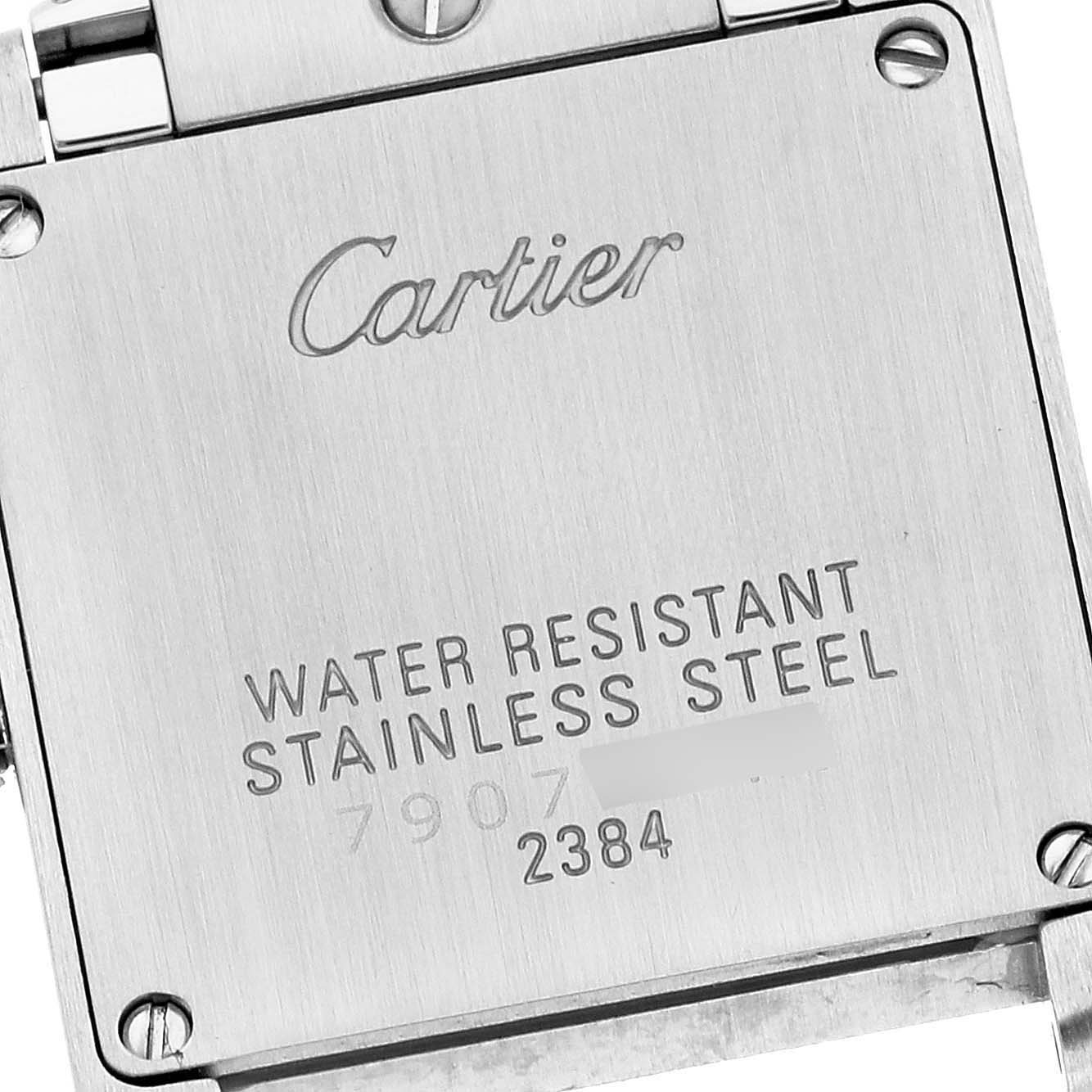 The image shows the back case of a Cartier Tank Francaise W51028Q3 Women's Stainless Steel Mother of Pearl Dial W51028Q3 Women's Stainless Steel Mother of Pearl Dial watch with engraved details about water resistance and material.