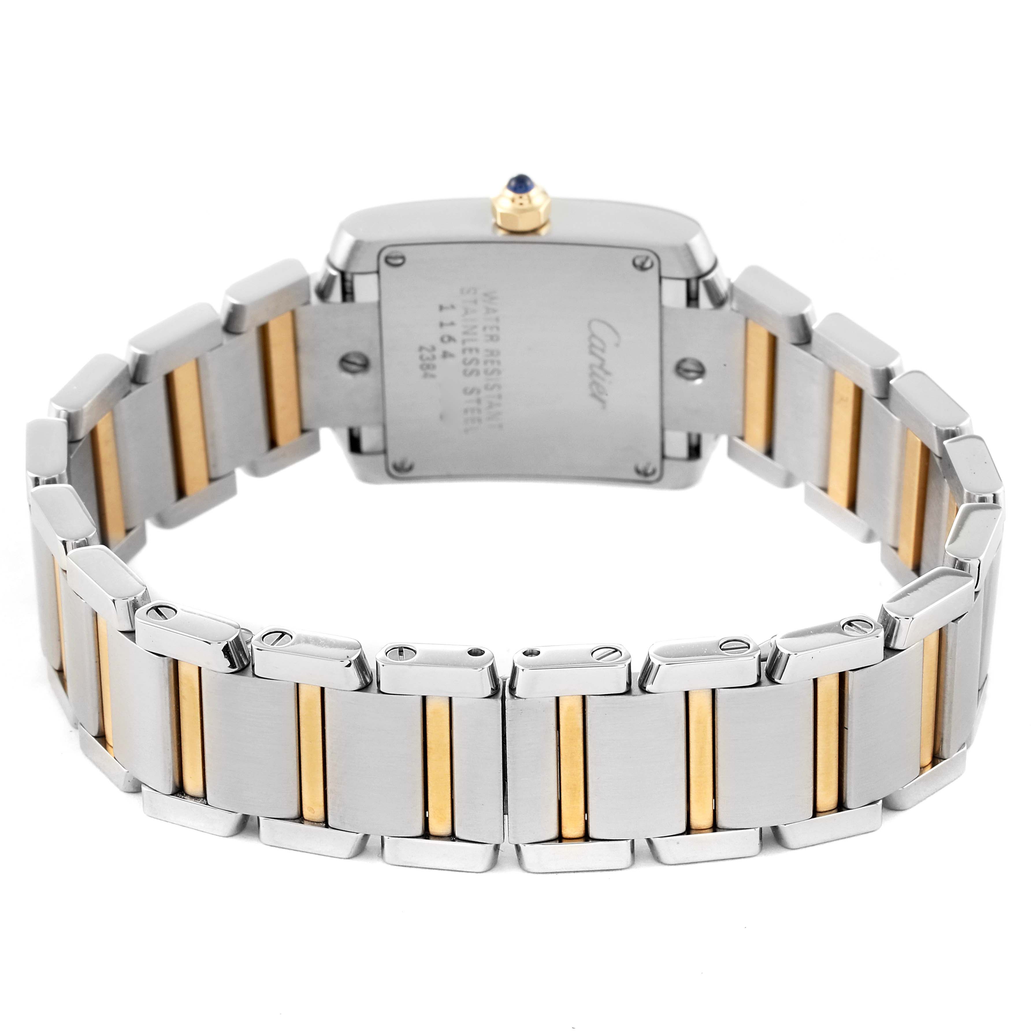 The image shows the back view of a Cartier Tank Francaise W51007Q4 Women's Steel and Gold (two tone) Silver Dial W51007Q4 Women's Steel and Gold (two tone) Silver Dial watch, focusing on the stainless steel and gold bracelet and case back.