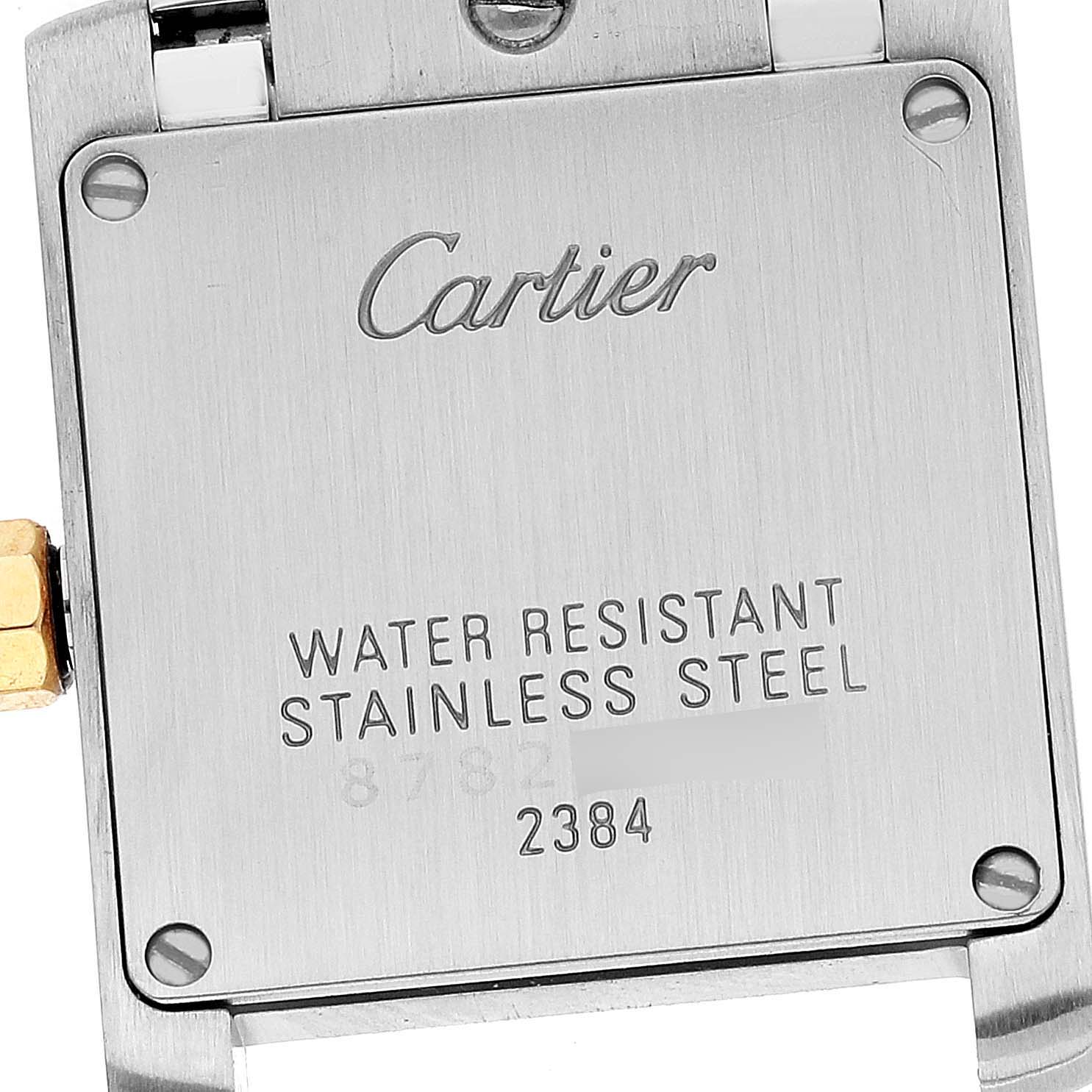 This image shows the back of the Tank Francaise watch by Cartier, displaying its water resistance and stainless steel label.