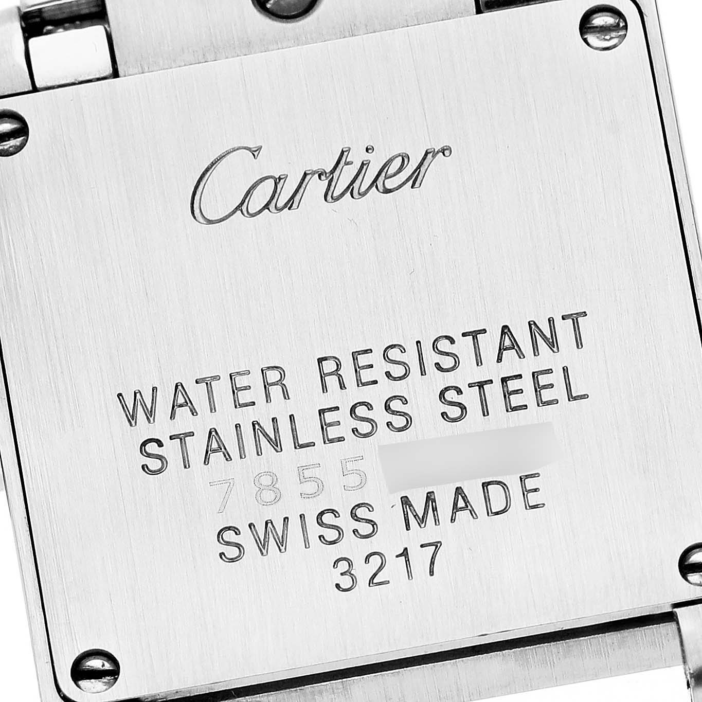 The image shows the back case of a Cartier Tank Francaise W51007Q4 Women
s Steel and Gold (two tone) Silver Dial W51007Q4 Women
s Steel and Gold (two tone) Silver Dial watch with engraved details and screws visible.