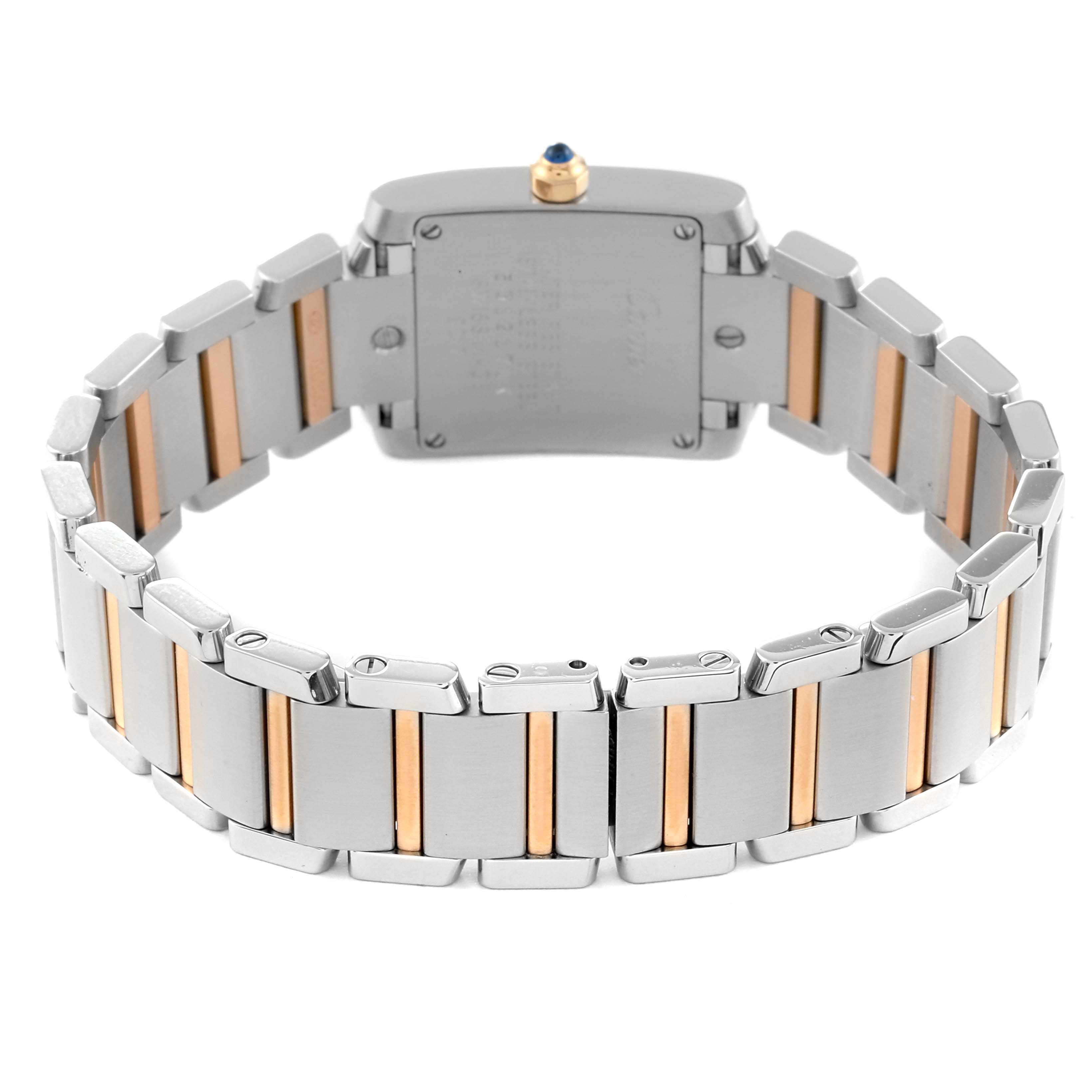 The image shows the rear view of a Tank Française watch by Cartier, highlighting the metal bracelet and clasp.