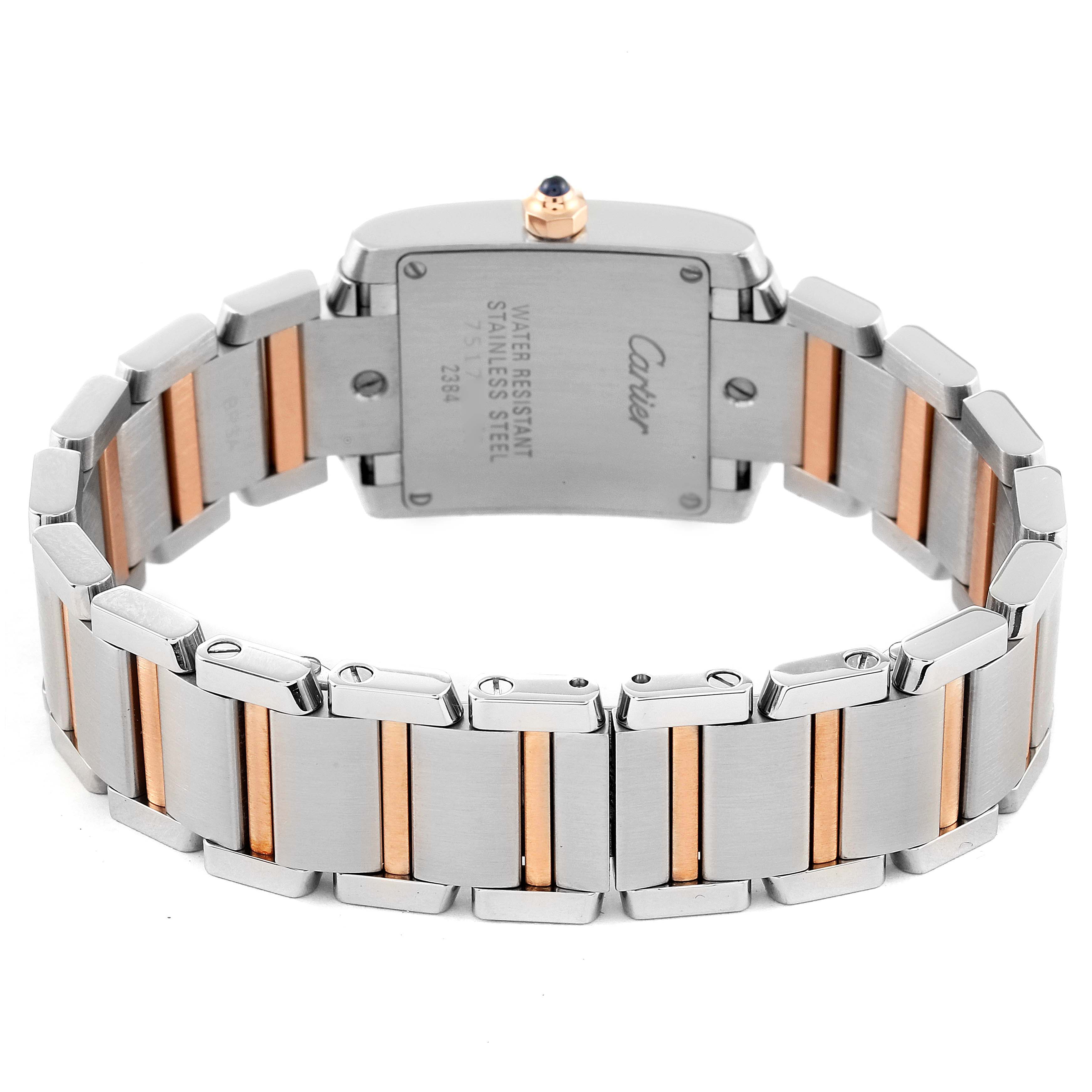The image shows the back view of a Cartier Tank Française watch, highlighting its stainless steel and gold bracelet.