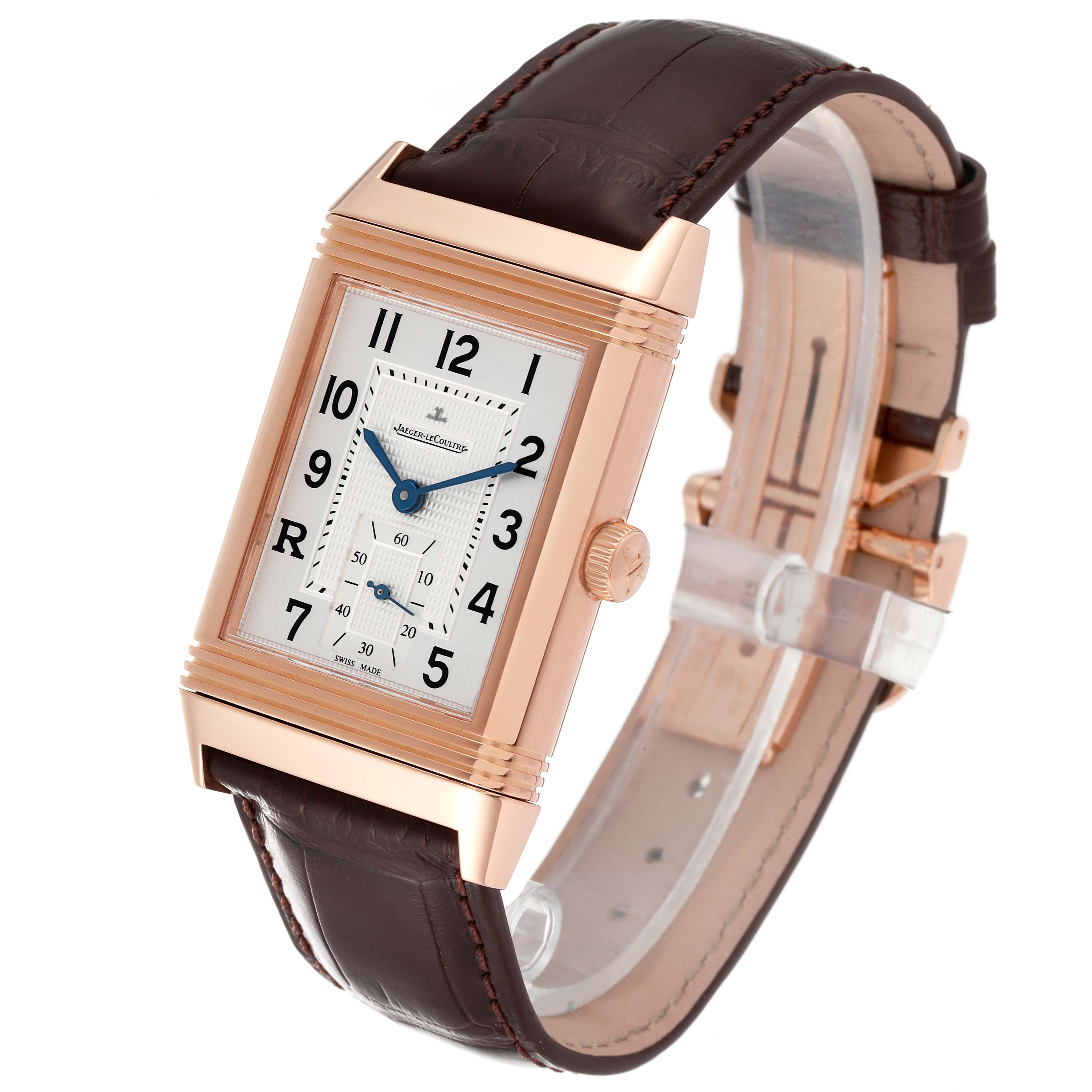 The Jaeger LeCoultre Reverso Q3732420 Men's Rose Gold Silver Dial Q3732420 Men's Rose Gold Silver Dial watch is shown at a slight right side angle, displaying its rectangular face, crown, and leather strap.